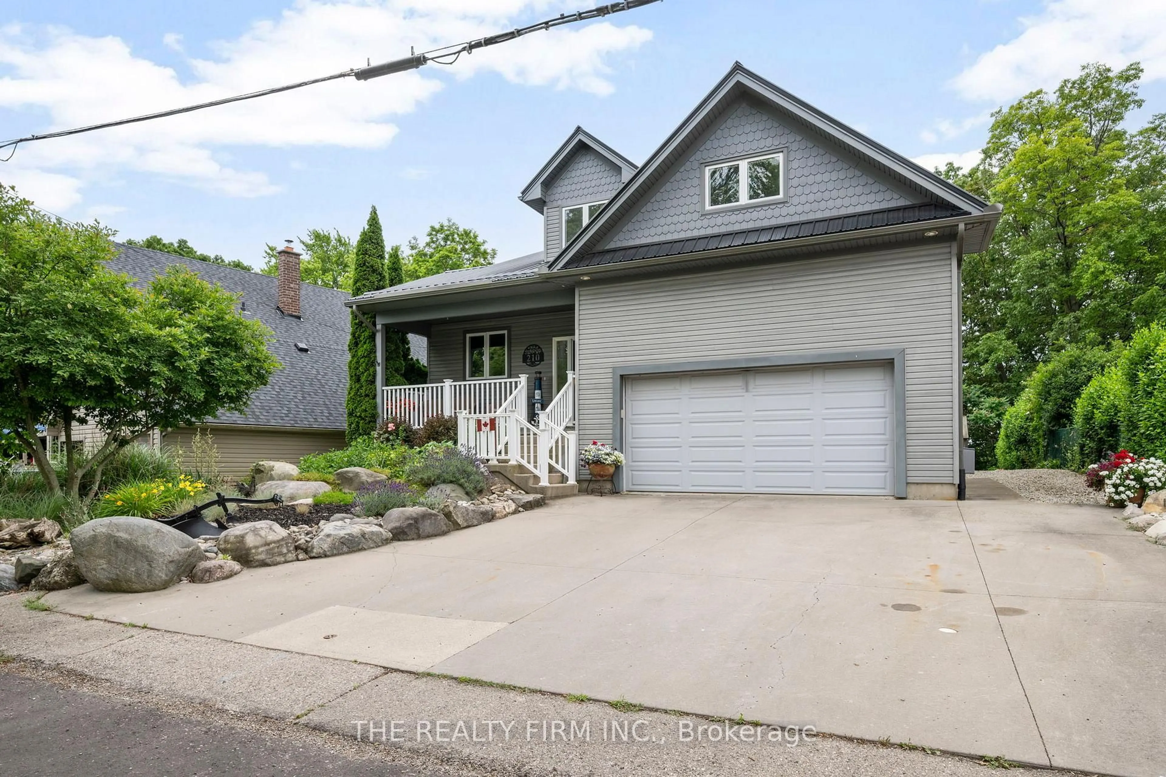 Home with vinyl exterior material, street for 210 Cornell Dr, Central Elgin Ontario N5L 1A5