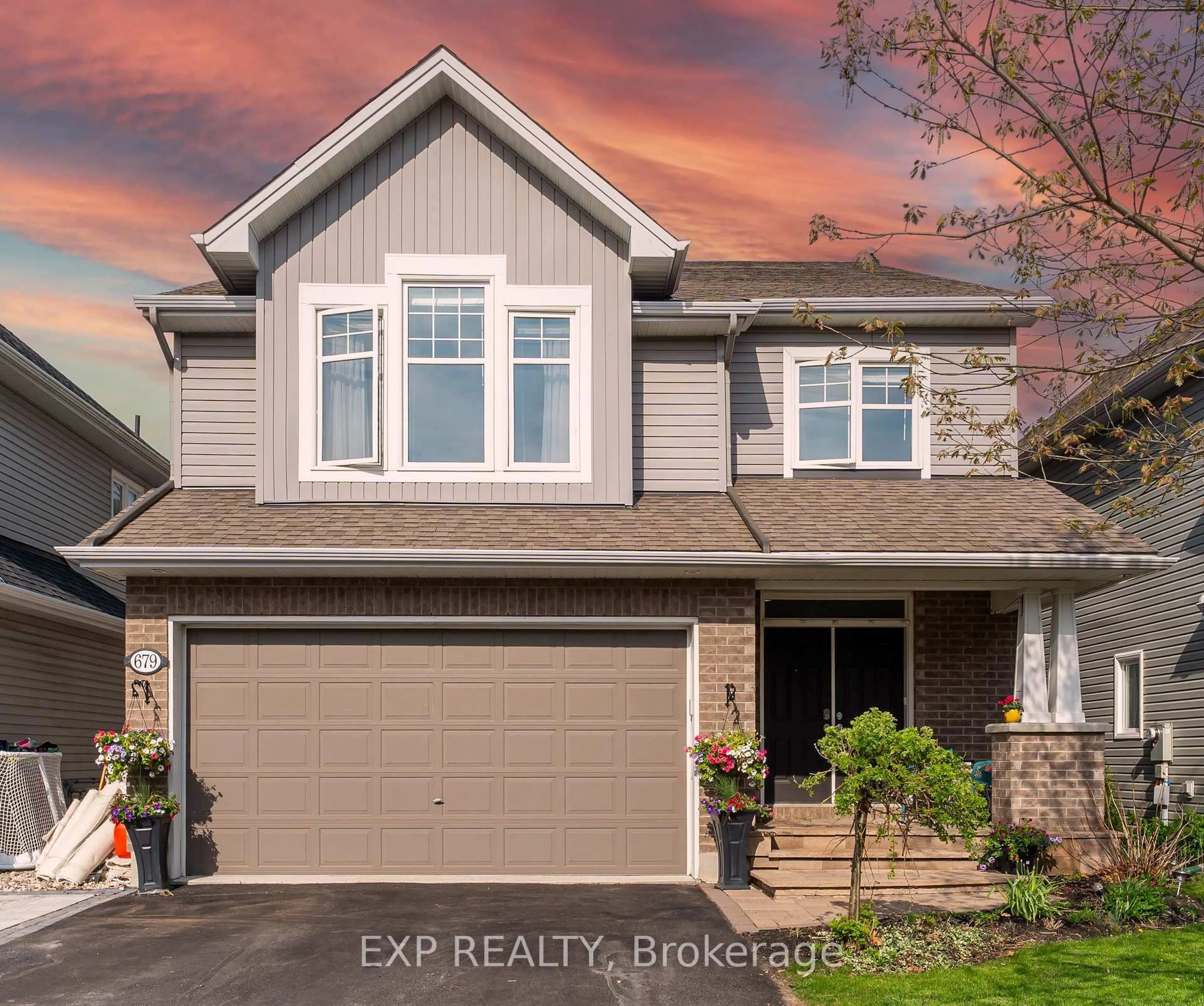 Home with vinyl exterior material, street for 679 Rockrose Way, Ottawa Ontario K1T 0L7