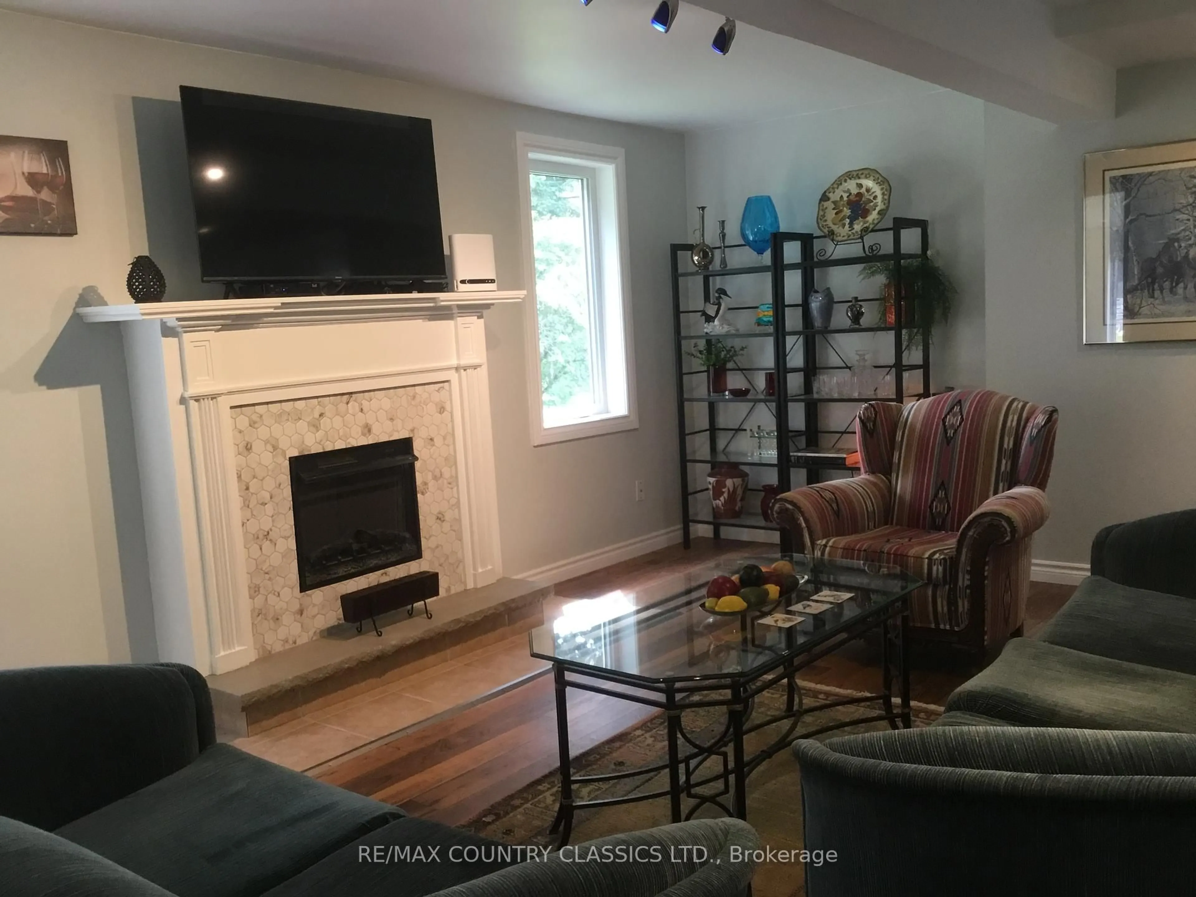 Living room with furniture, wood/laminate floor for 12 Hastings St, Bancroft Ontario K0L 1C0