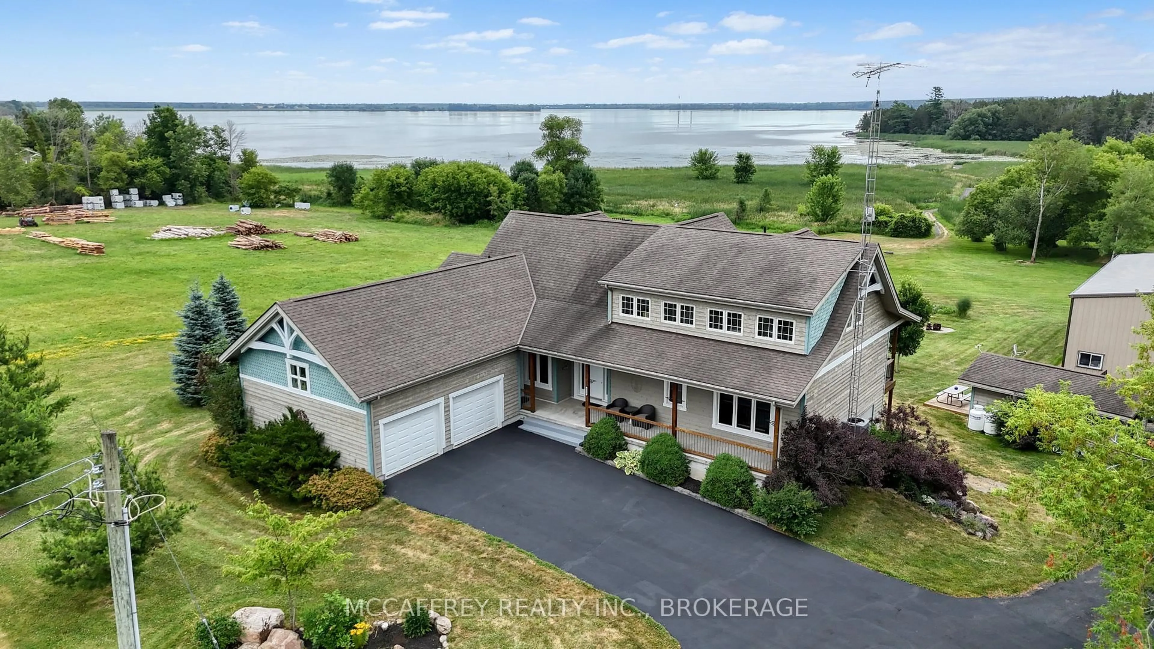 A pic from outside/outdoor area/front of a property/back of a property/a pic from drone, water/lake/river/ocean view for 6019 County Road 9, Napanee Ontario K7R 3K8