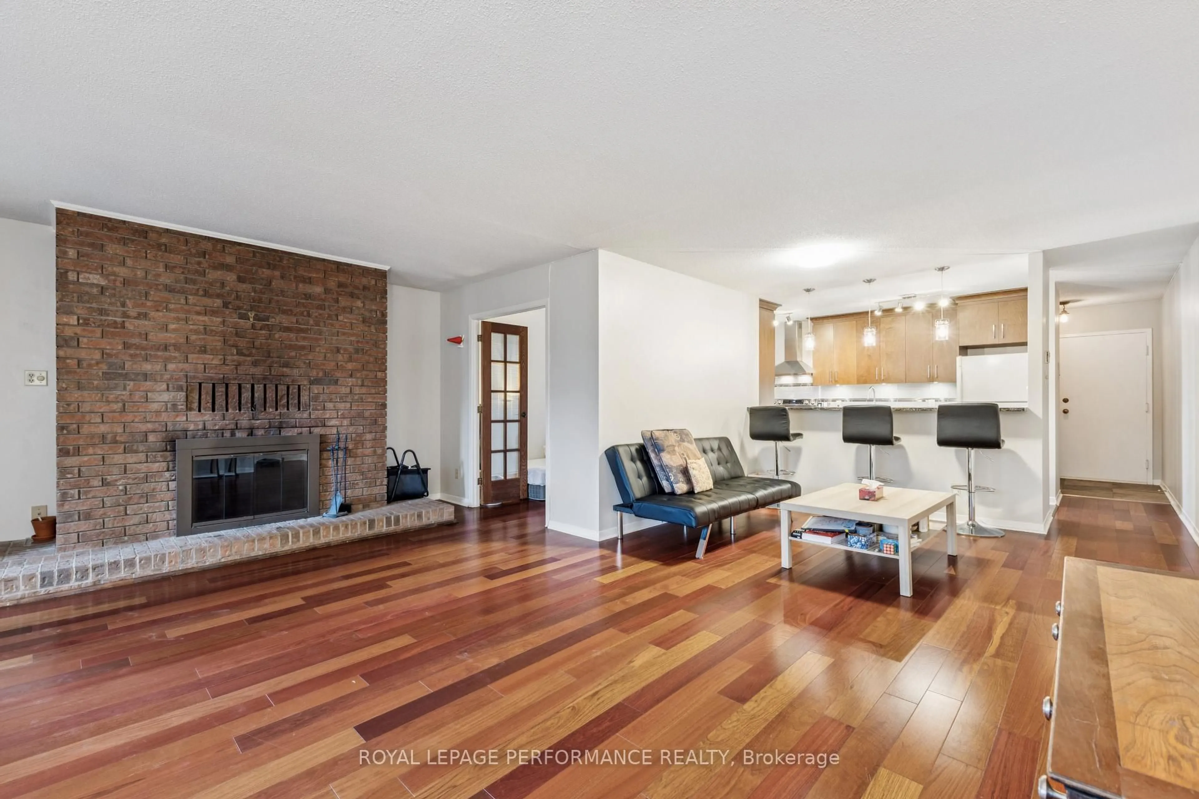 Living room with furniture, wood/laminate floor for 71 Sweetland Ave #4, Ottawa Ontario K1N 7T9