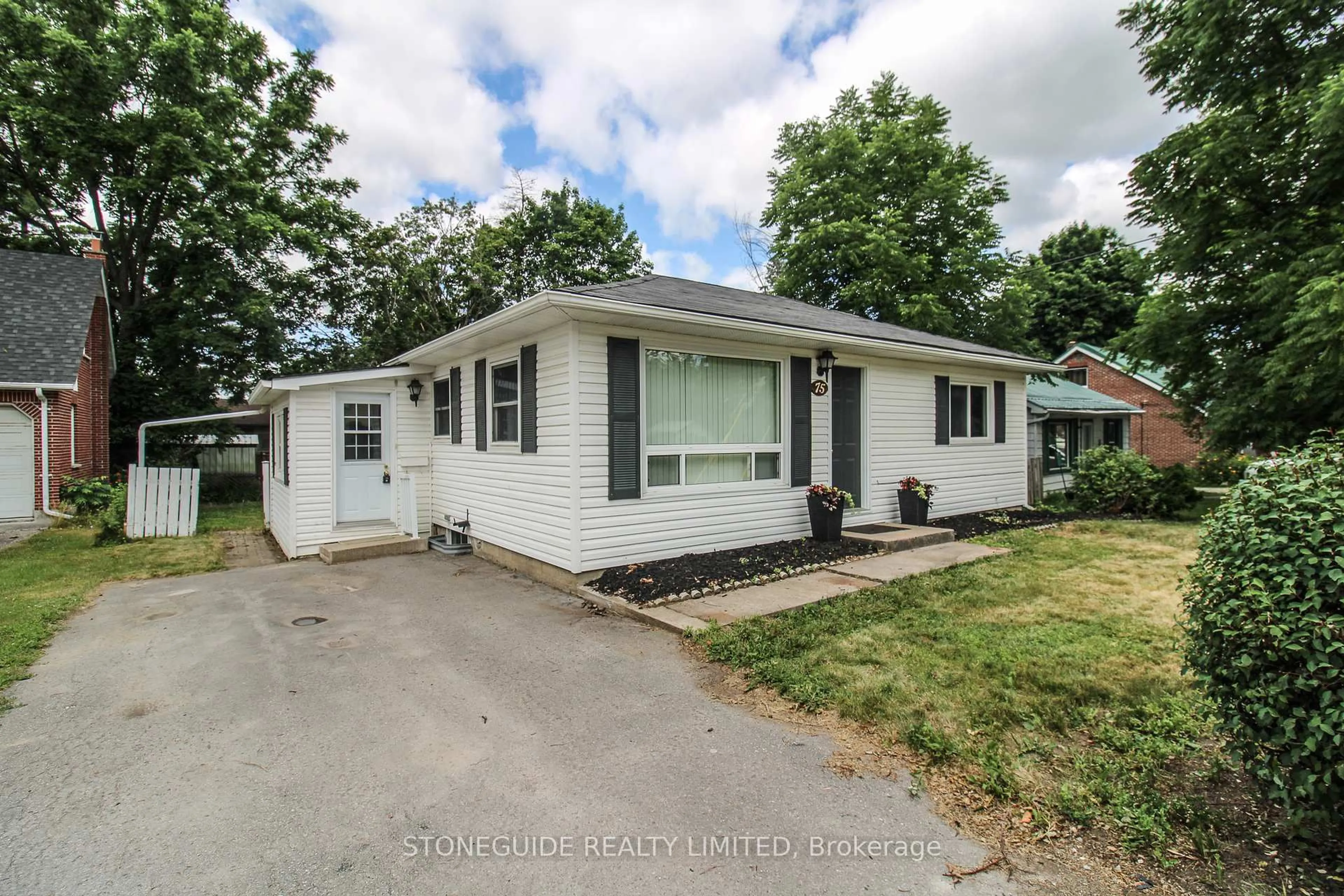 Home with vinyl exterior material, street for 75 Fraser St, Selwyn Ontario K9J 0C5