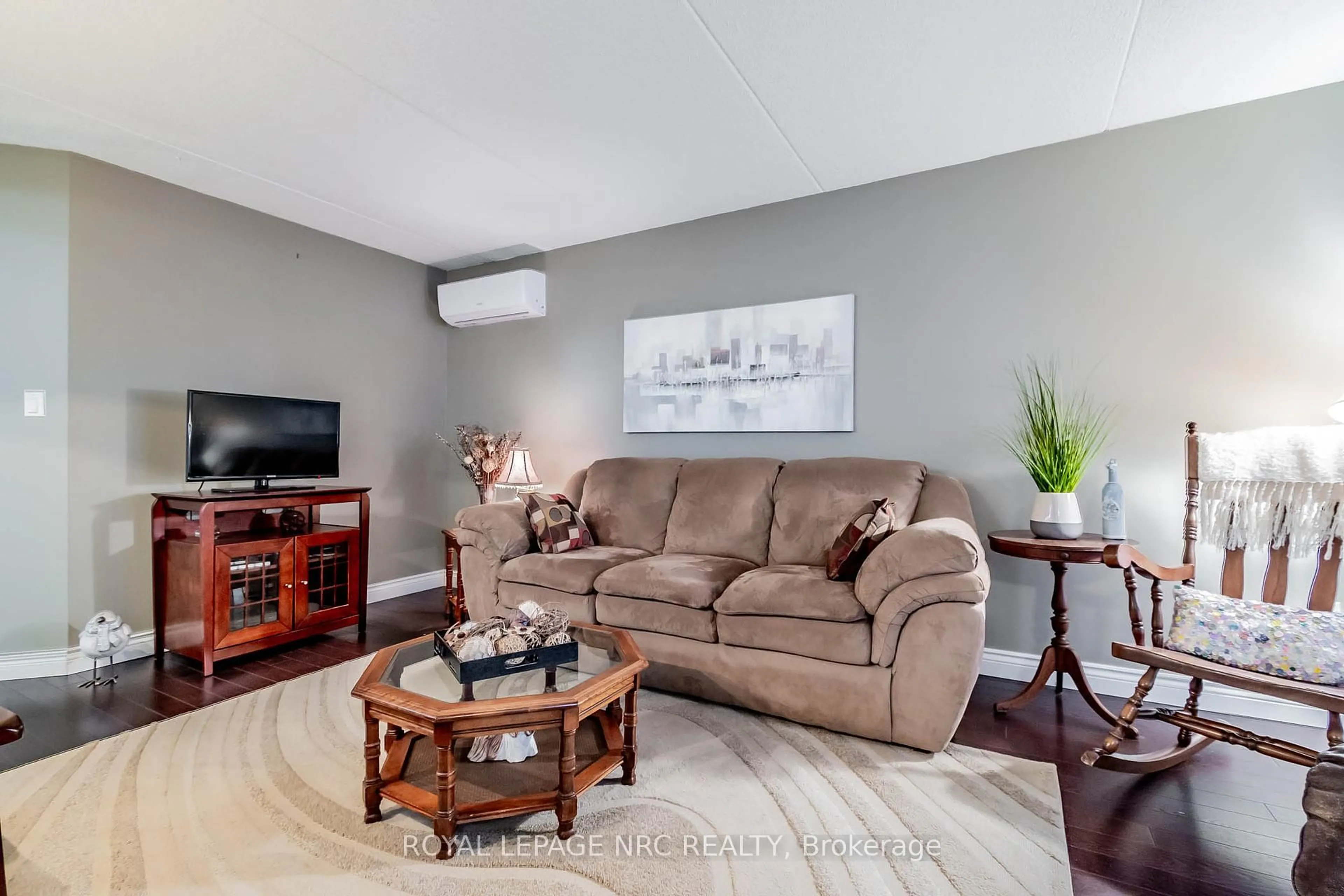 Living room with furniture, unknown for 4658 Drummond Rd #230, Niagara Falls Ontario L2E 7E1