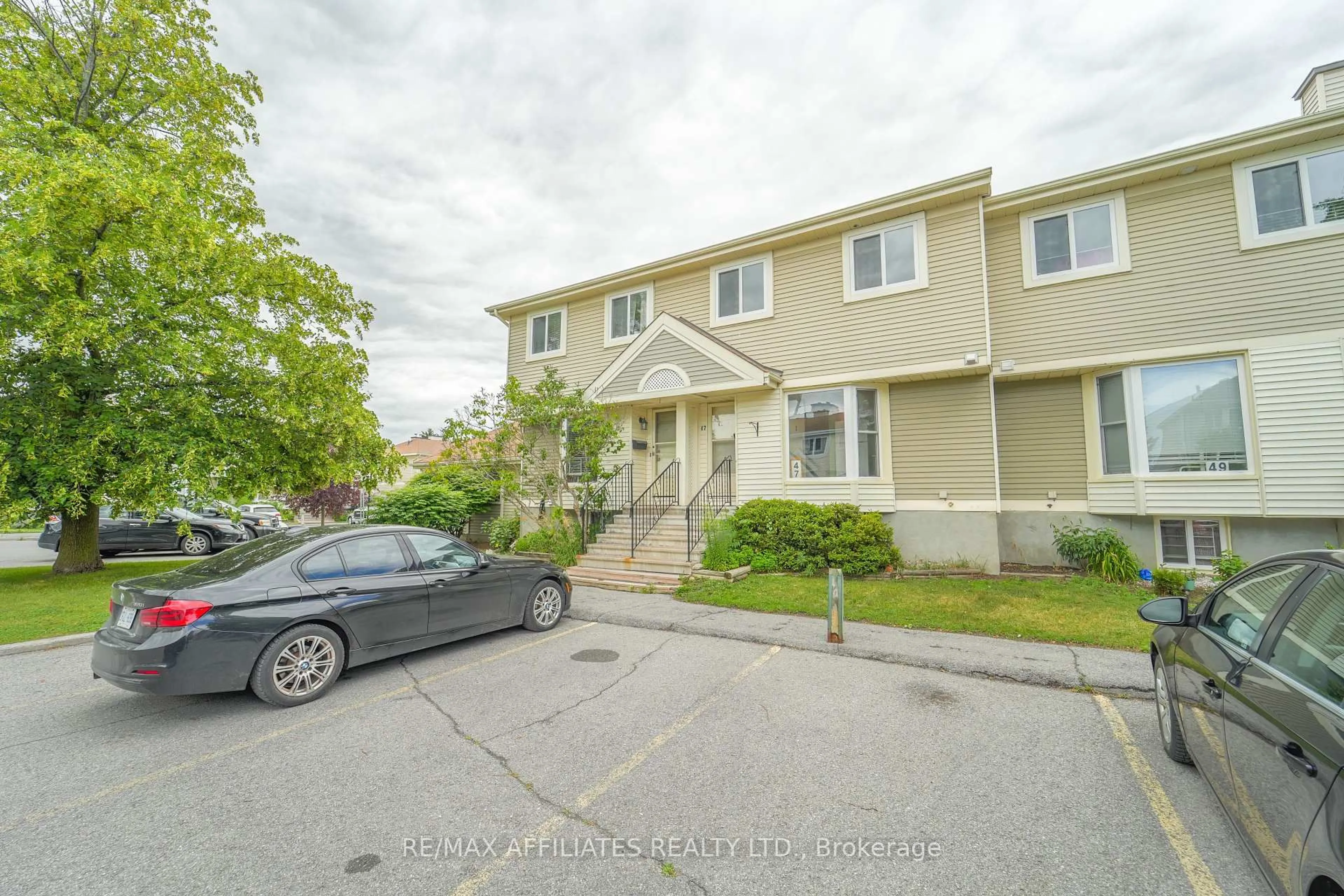 A pic from outside/outdoor area/front of a property/back of a property/a pic from drone, street for 47 Mcdermot Crt #65, Ottawa Ontario K2L 3V5