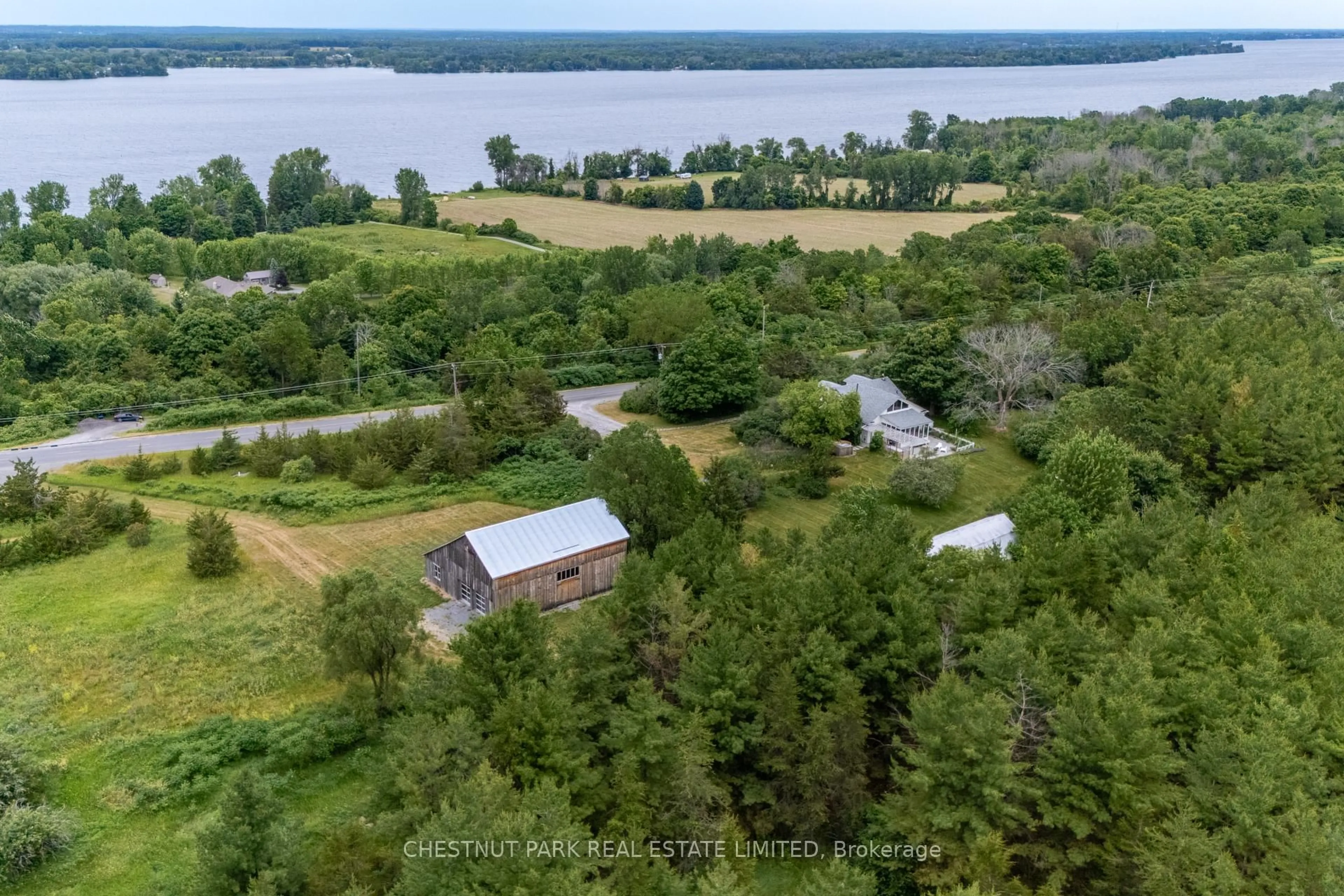 A pic from outside/outdoor area/front of a property/back of a property/a pic from drone, water/lake/river/ocean view for 1472 County Rd 7 Rd, Prince Edward County Ontario K0K 2T0