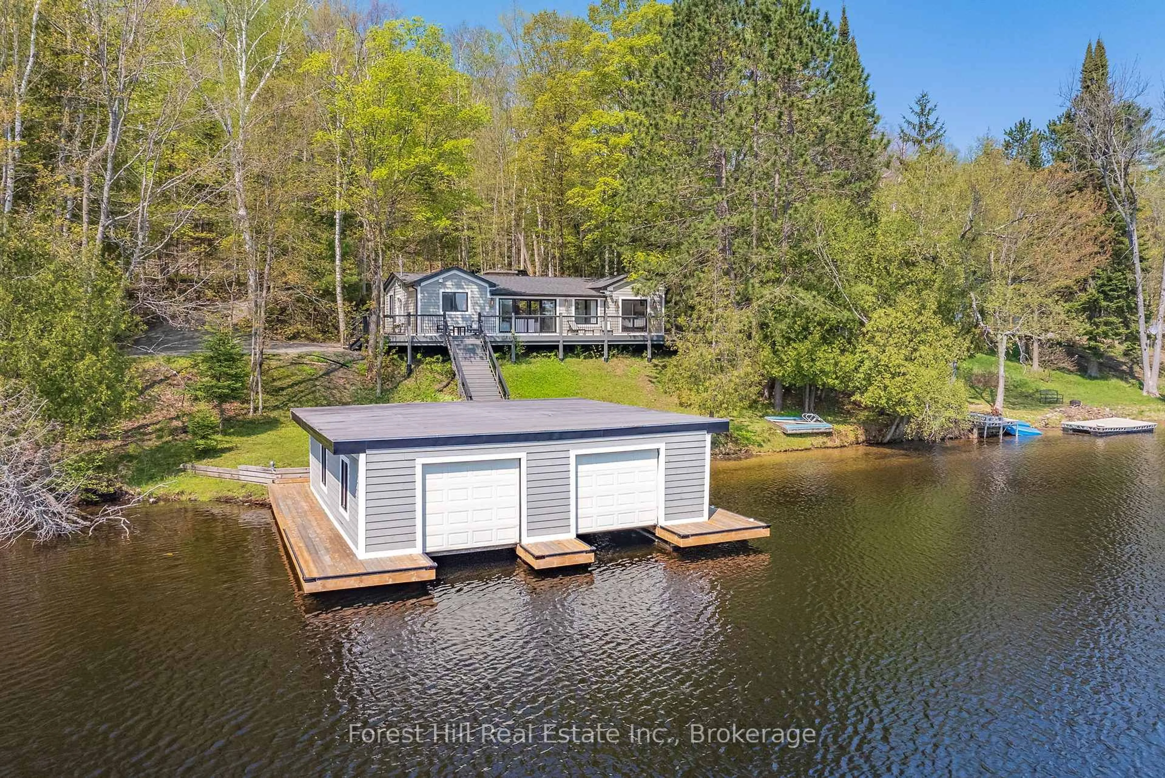 A pic from outside/outdoor area/front of a property/back of a property/a pic from drone, water/lake/river/ocean view for 1017 WHITE PINE Rd, Lake of Bays Ontario P1H 2J3