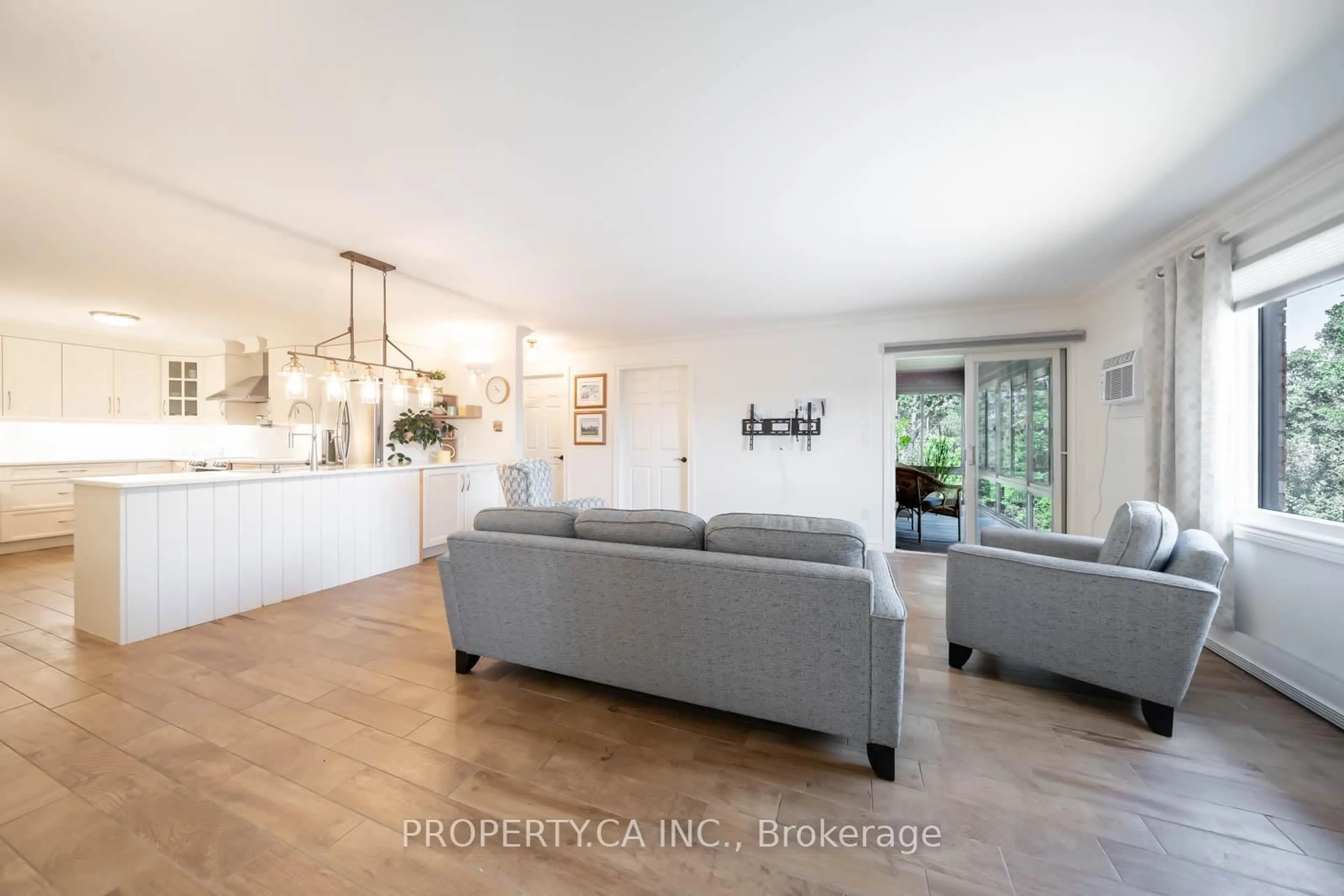 Living room with furniture, wood/laminate floor for 90 King St #7, Kawartha Lakes Ontario K0M 1A0