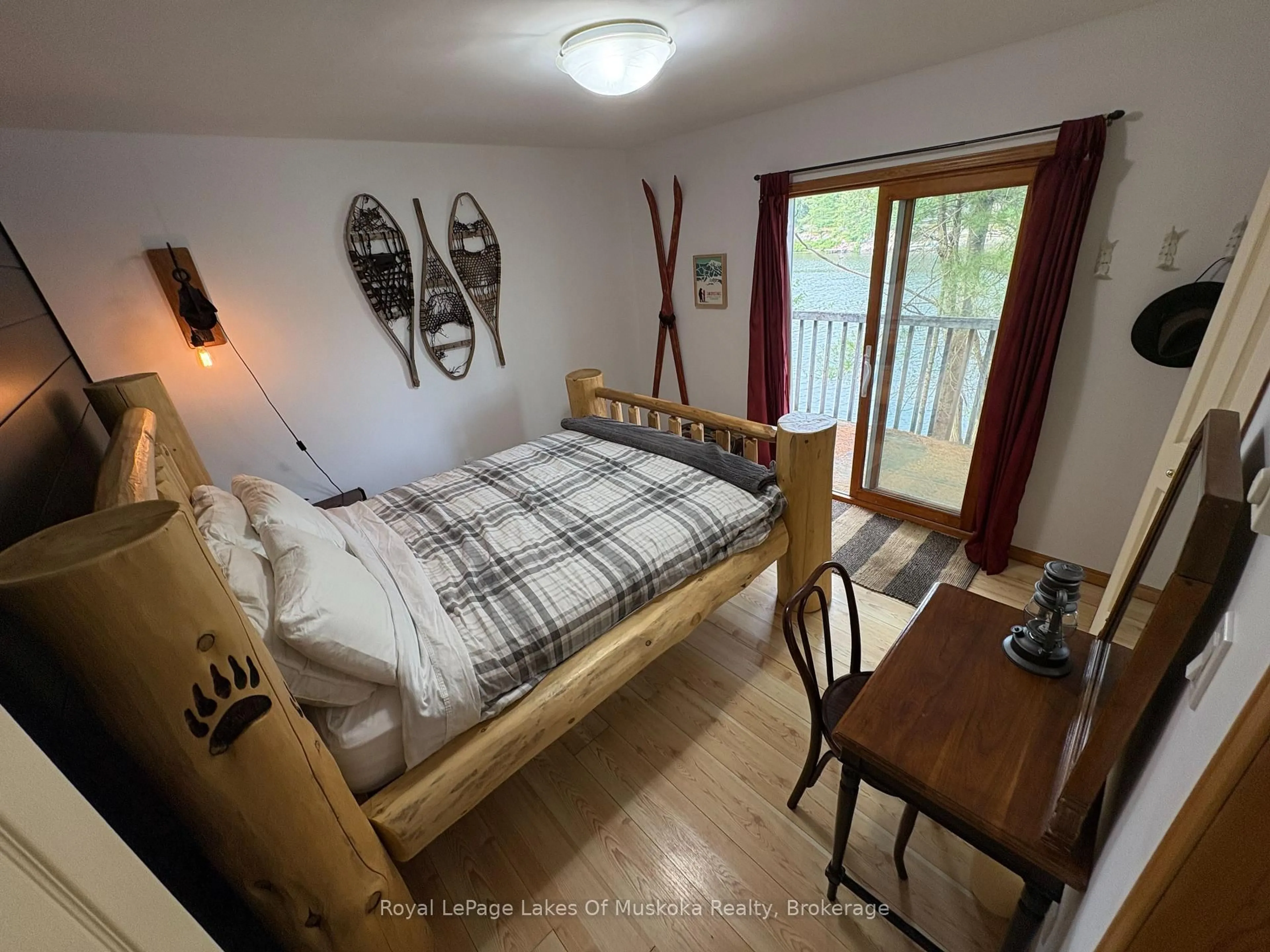 Bedroom with bed, wood/laminate floor for 1 3LN Berkinshaw Island, Gravenhurst Ontario P1P 1R2