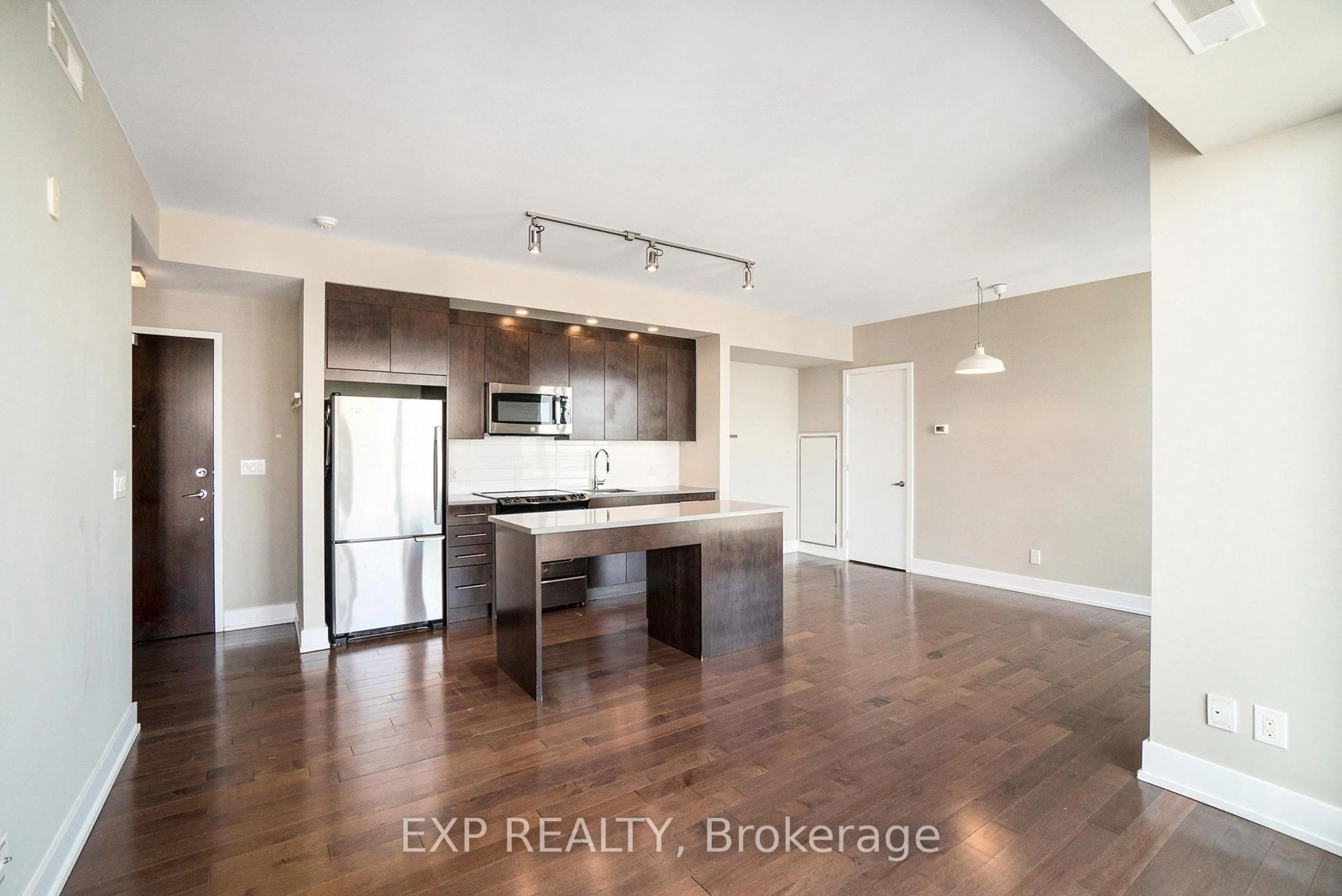 Open concept kitchen, wood/laminate floor for 360 Patricia Ave #814, Ottawa Ontario K1Z 0A8