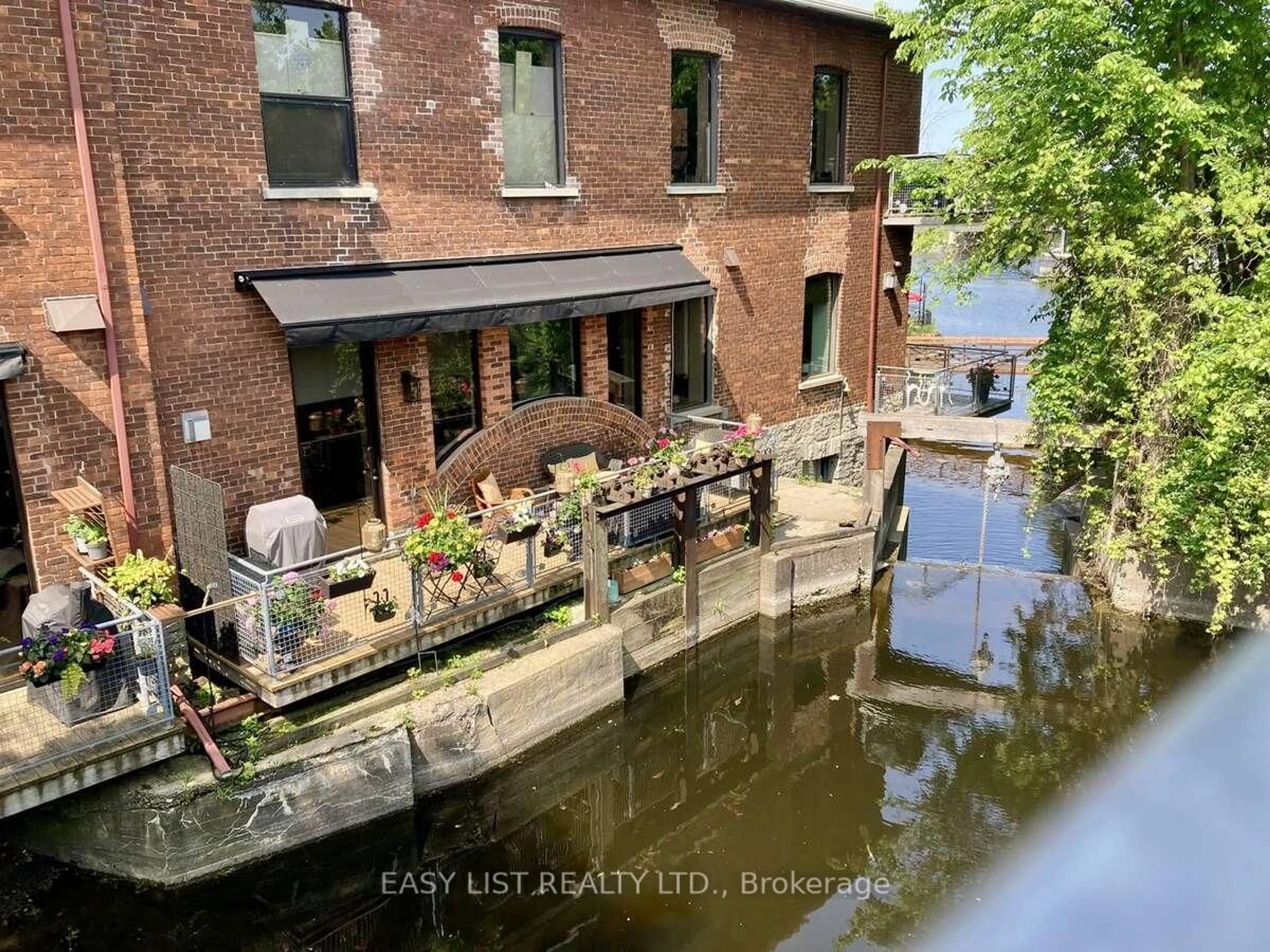 A pic from outside/outdoor area/front of a property/back of a property/a pic from drone, city buildings view from balcony for 83 Little Bridge St #112, Almonte Ontario K0A 1A0