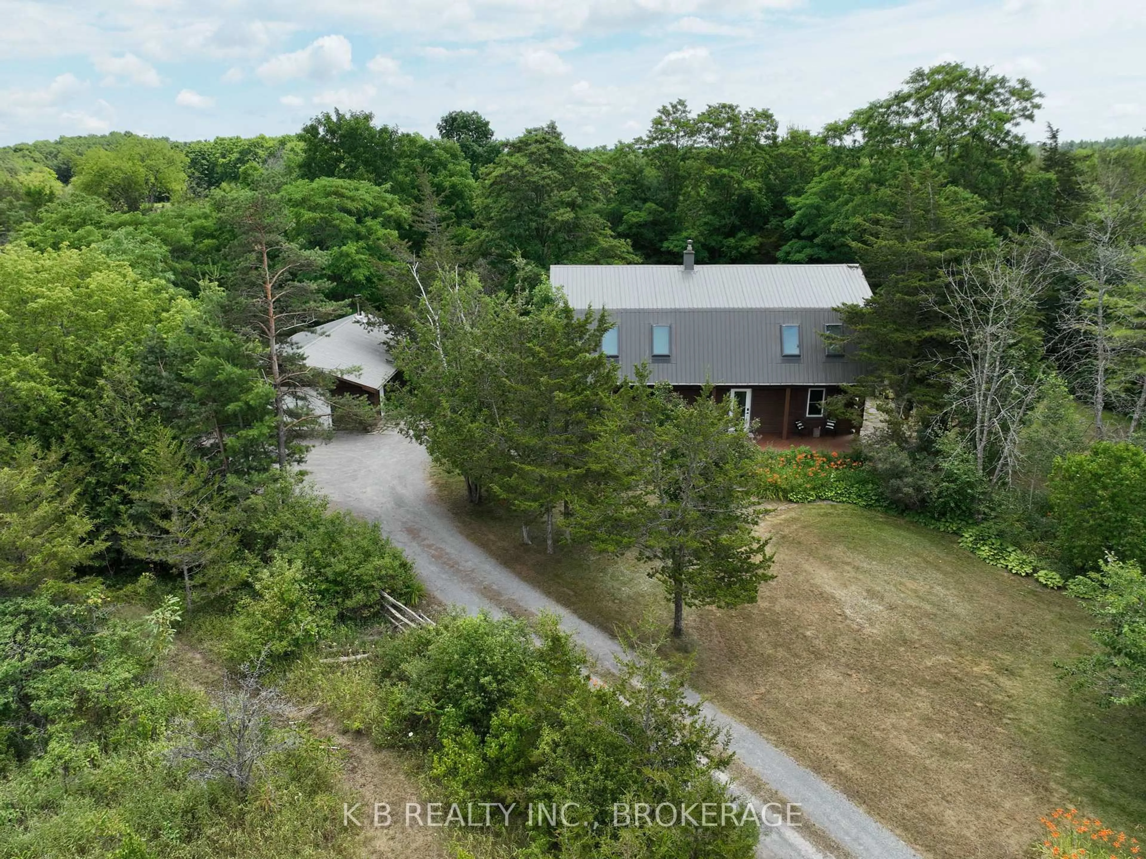A pic from outside/outdoor area/front of a property/back of a property/a pic from drone, forest/trees view for 255 Main St, Stone Mills Ontario K7K 1B1