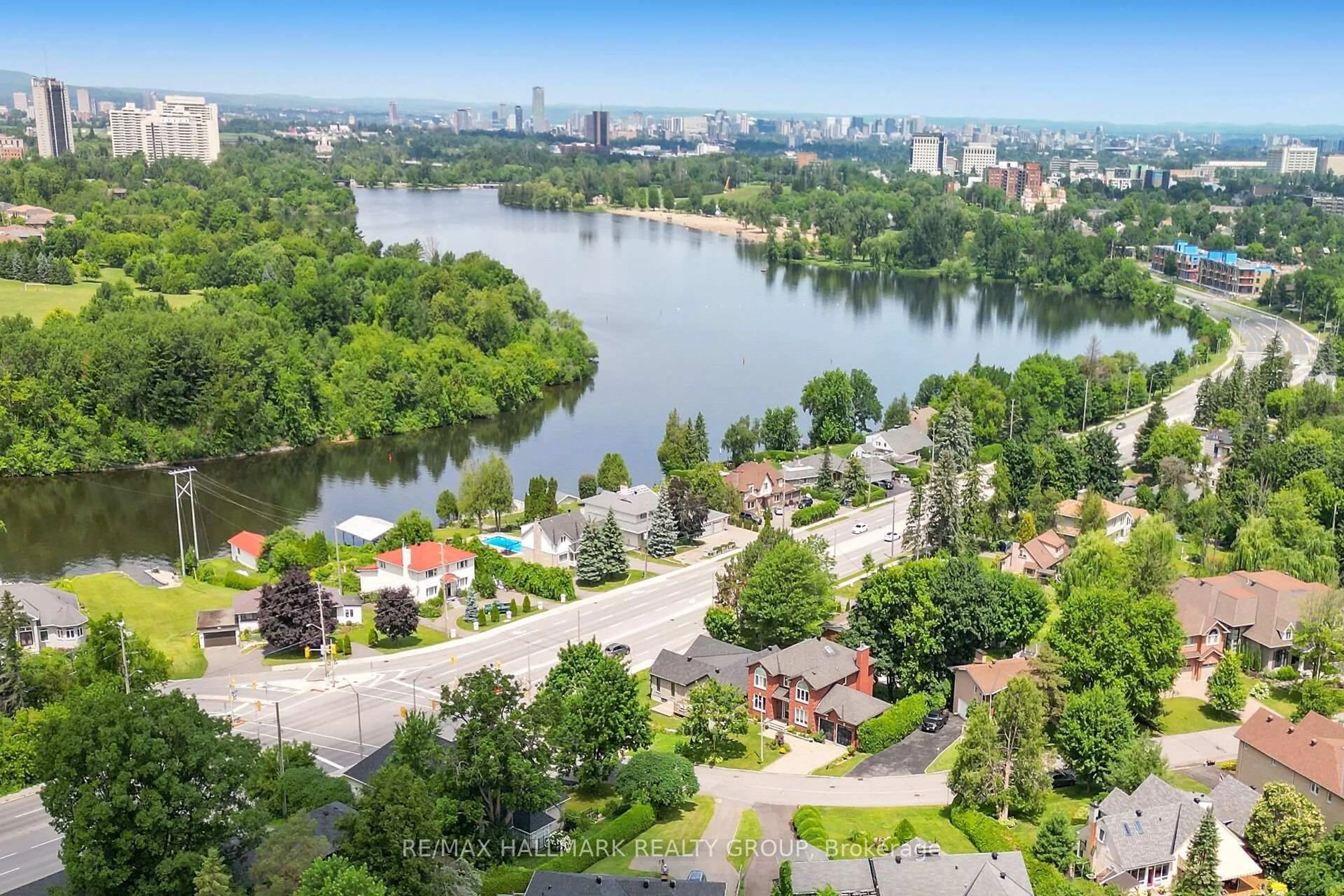 A pic from outside/outdoor area/front of a property/back of a property/a pic from drone, water/lake/river/ocean view for 3253 Riverside Dr, Ottawa Ontario K1V 8N8