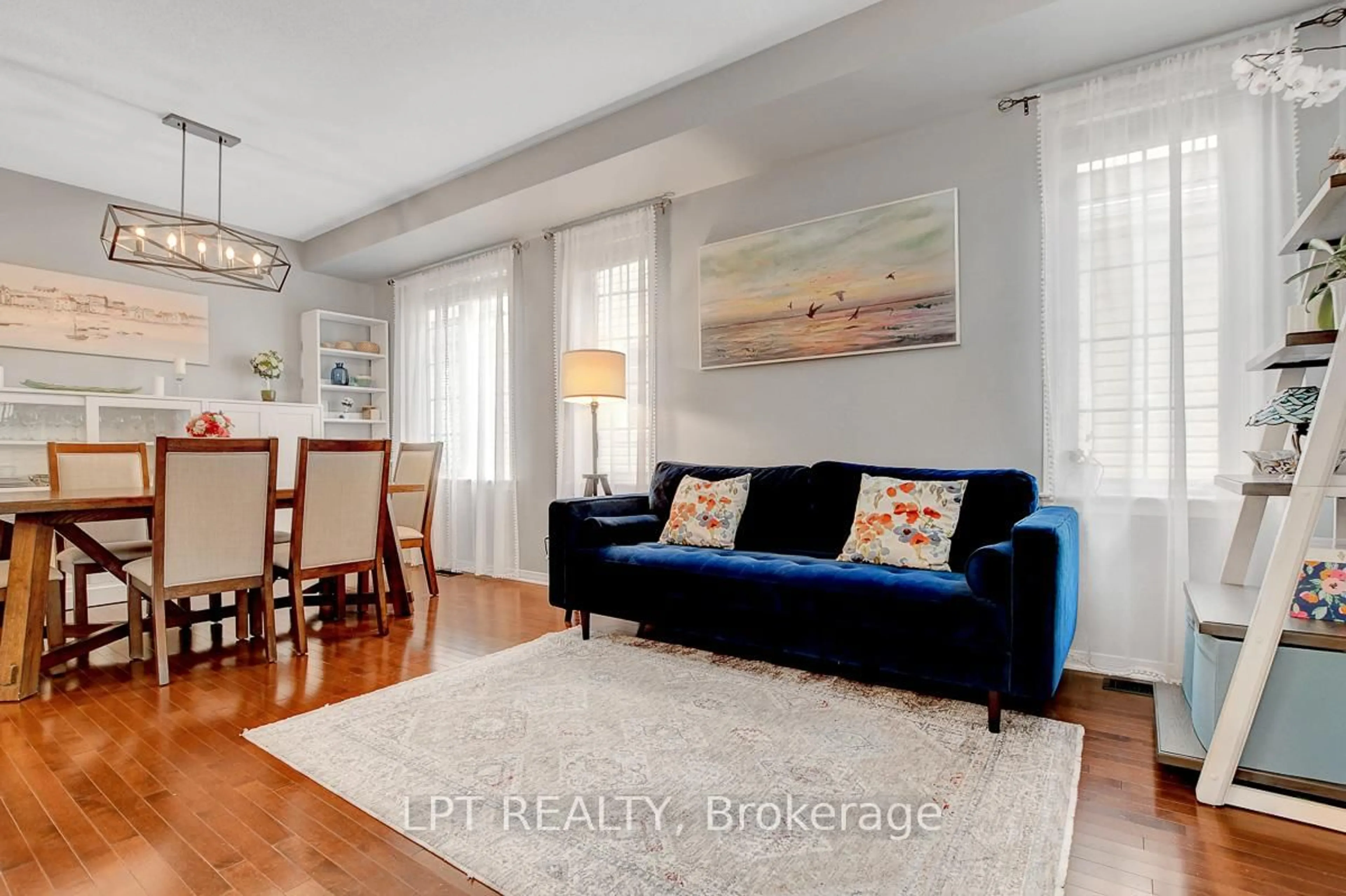 Living room with furniture, wood/laminate floor for 345 Eckerson Ave, Ottawa Ontario K2S 0K9