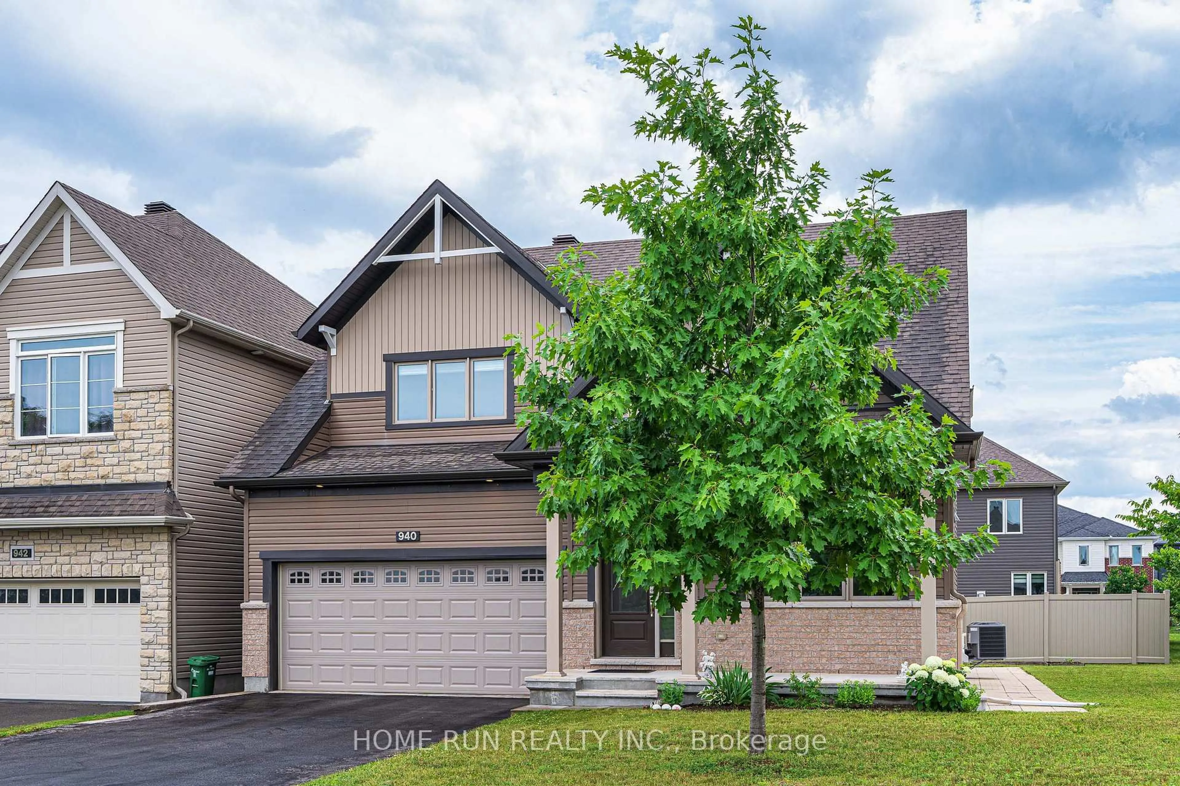 Home with brick exterior material, street for 940 Guinness Cres, Ottawa Ontario K2J 6G8