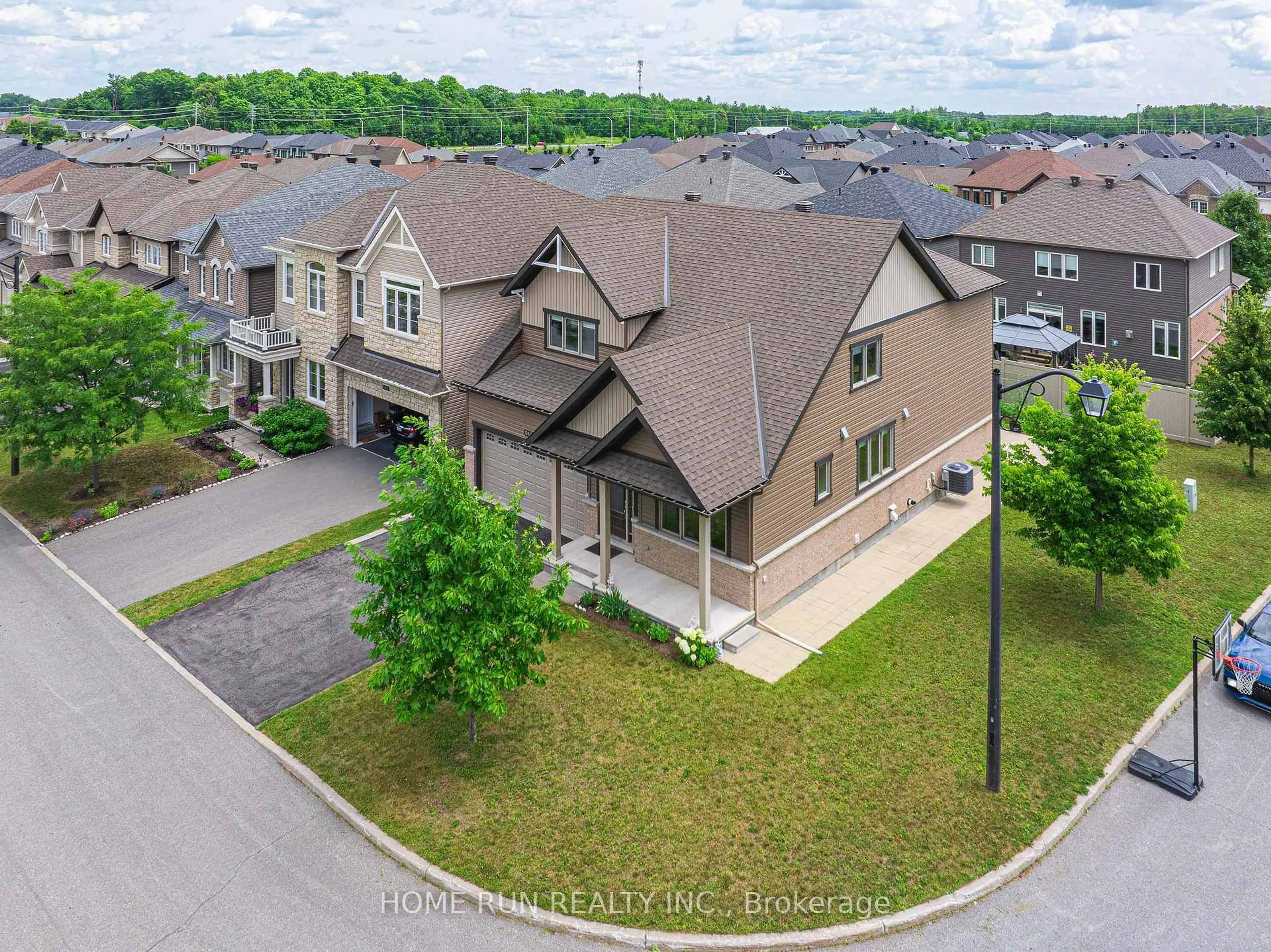 A pic from outside/outdoor area/front of a property/back of a property/a pic from drone, street for 940 Guinness Cres, Ottawa Ontario K2J 6G8