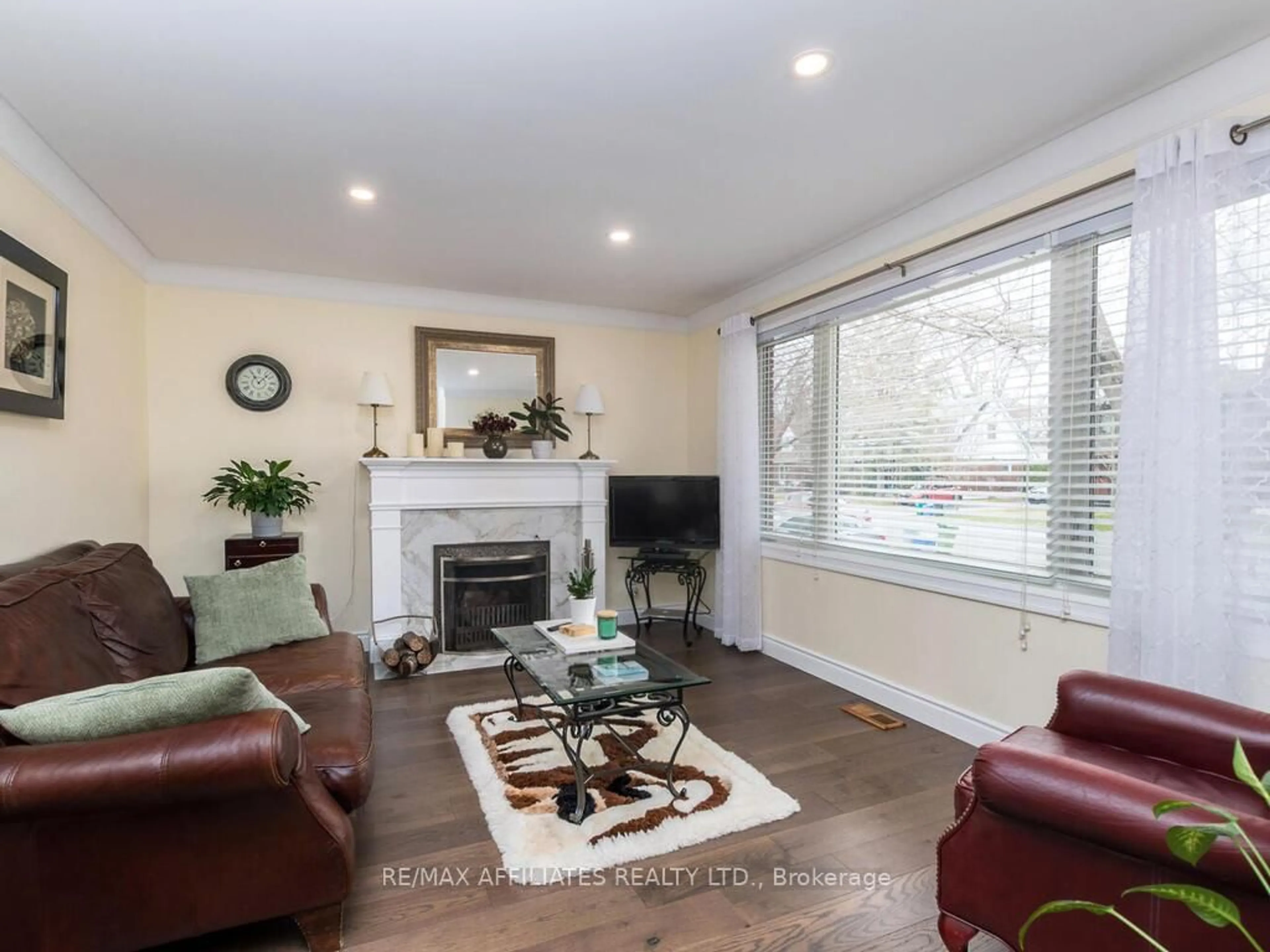 Living room with furniture, wood/laminate floor for 1941 Haig Dr, Ottawa Ontario K1G 2J9