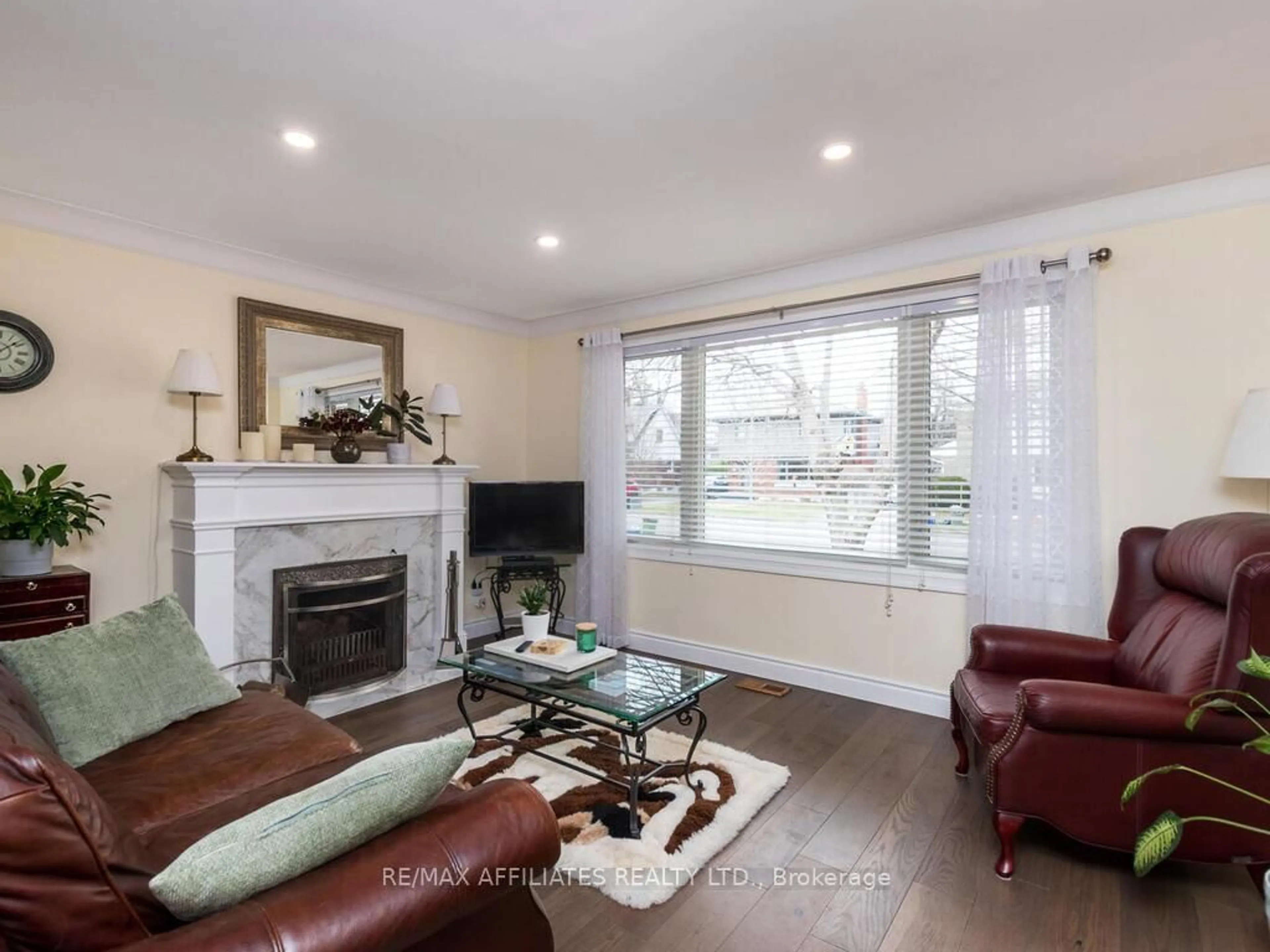 Living room with furniture, wood/laminate floor for 1941 Haig Dr, Ottawa Ontario K1G 2J9