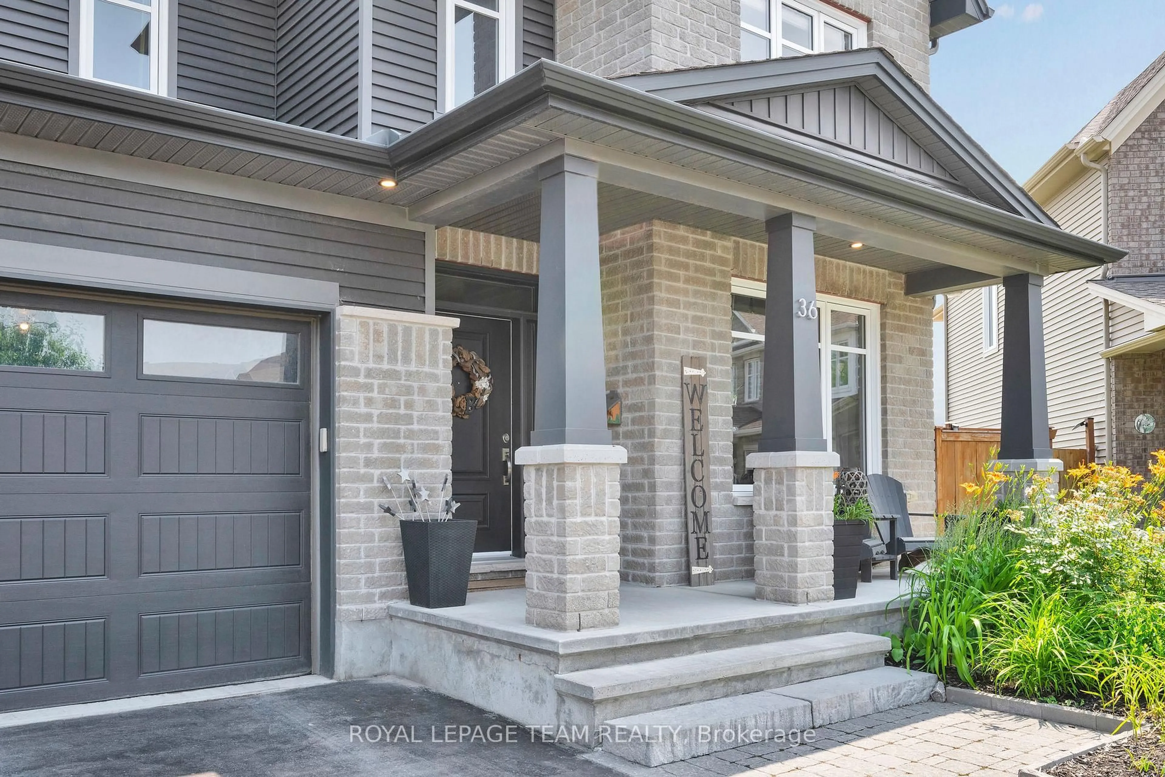 Home with brick exterior material, street for 36 Cento Way, Ottawa Ontario K2S 0W4
