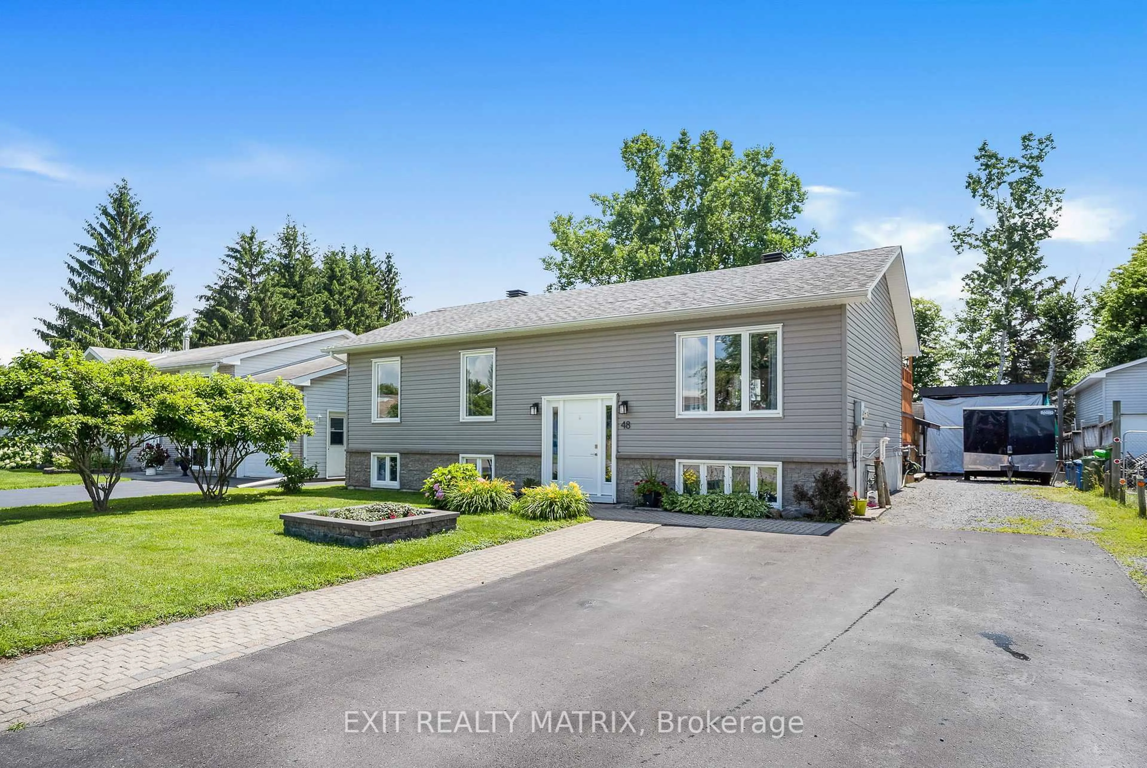 Home with vinyl exterior material, street for 48 Albert St, Russell Ontario K0A 1W0