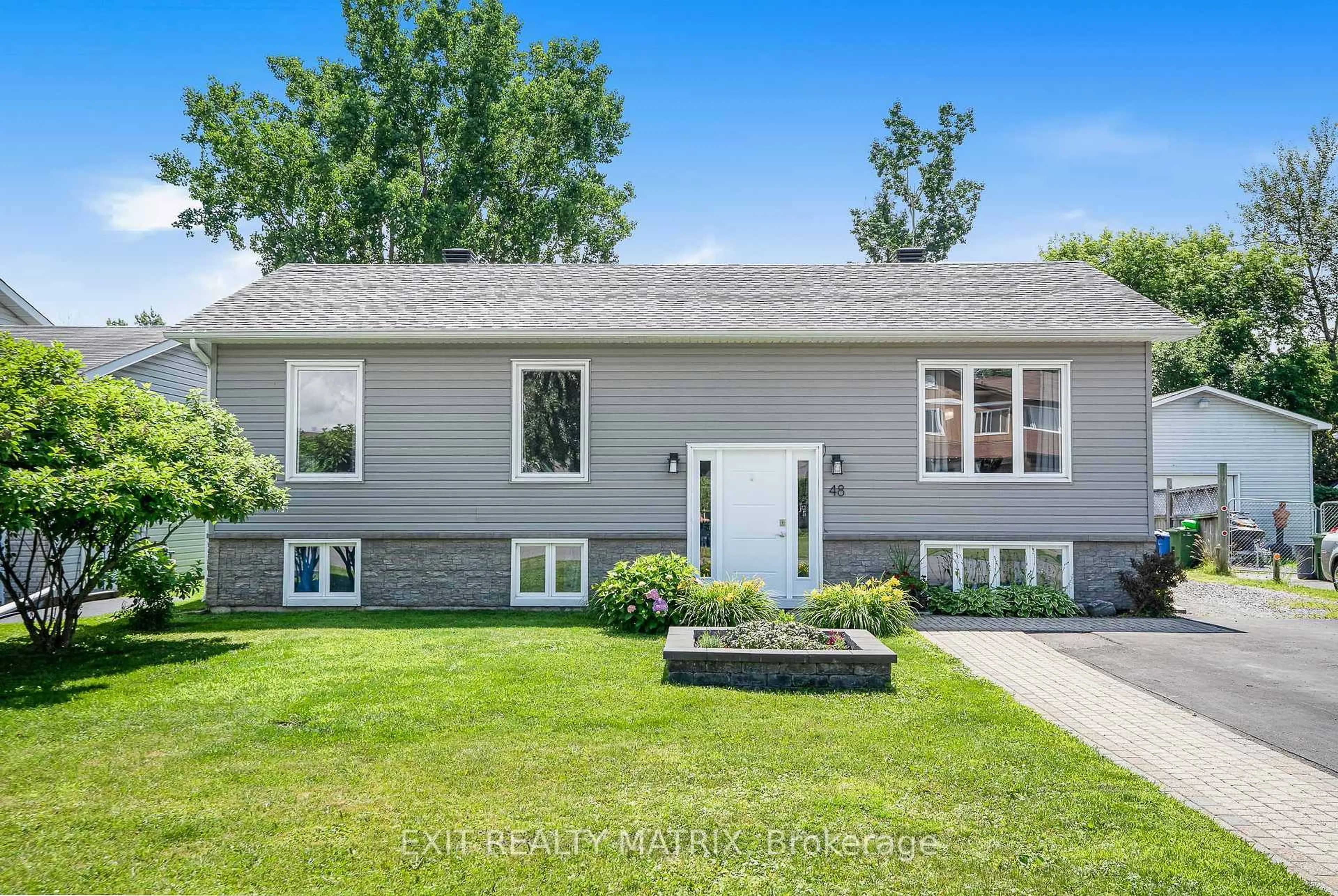 Home with vinyl exterior material, street for 48 Albert St, Russell Ontario K0A 1W0