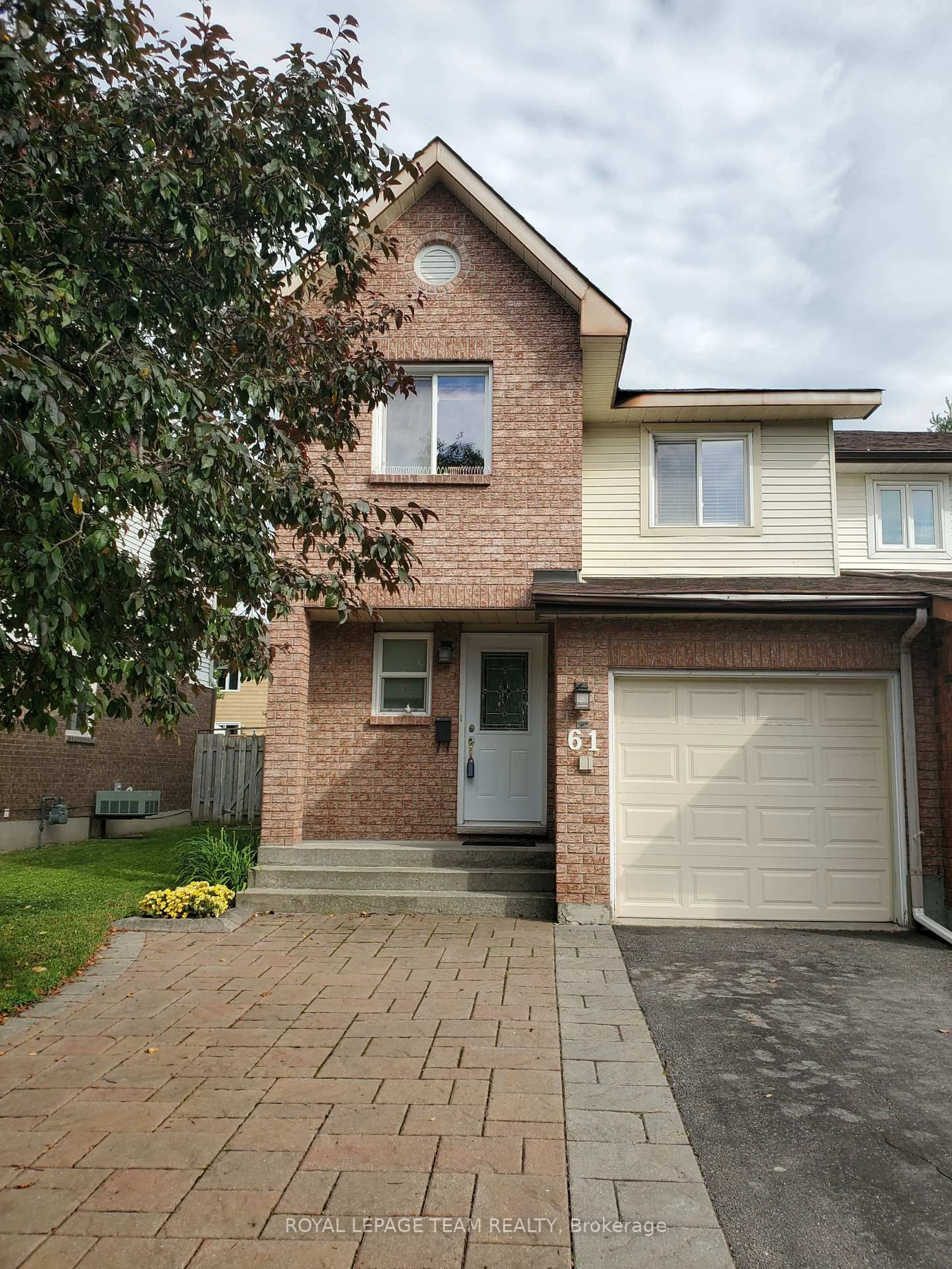 Home with brick exterior material, street for 61 McGibbon Dr, Kanata Ontario K2L 4A6