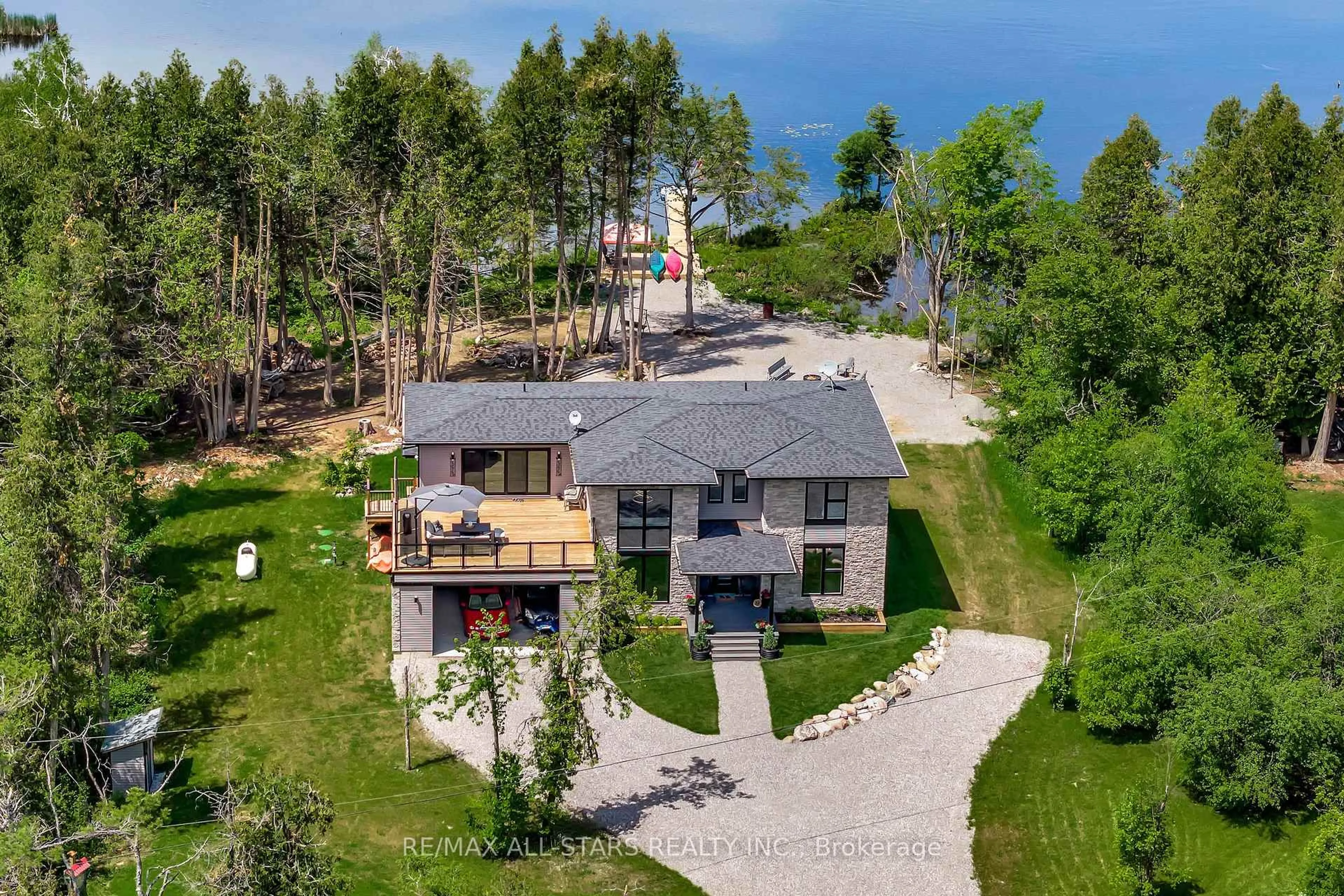 A pic from outside/outdoor area/front of a property/back of a property/a pic from drone, unknown for 15 Berry Lane, Kawartha Lakes Ontario K0M 1A0