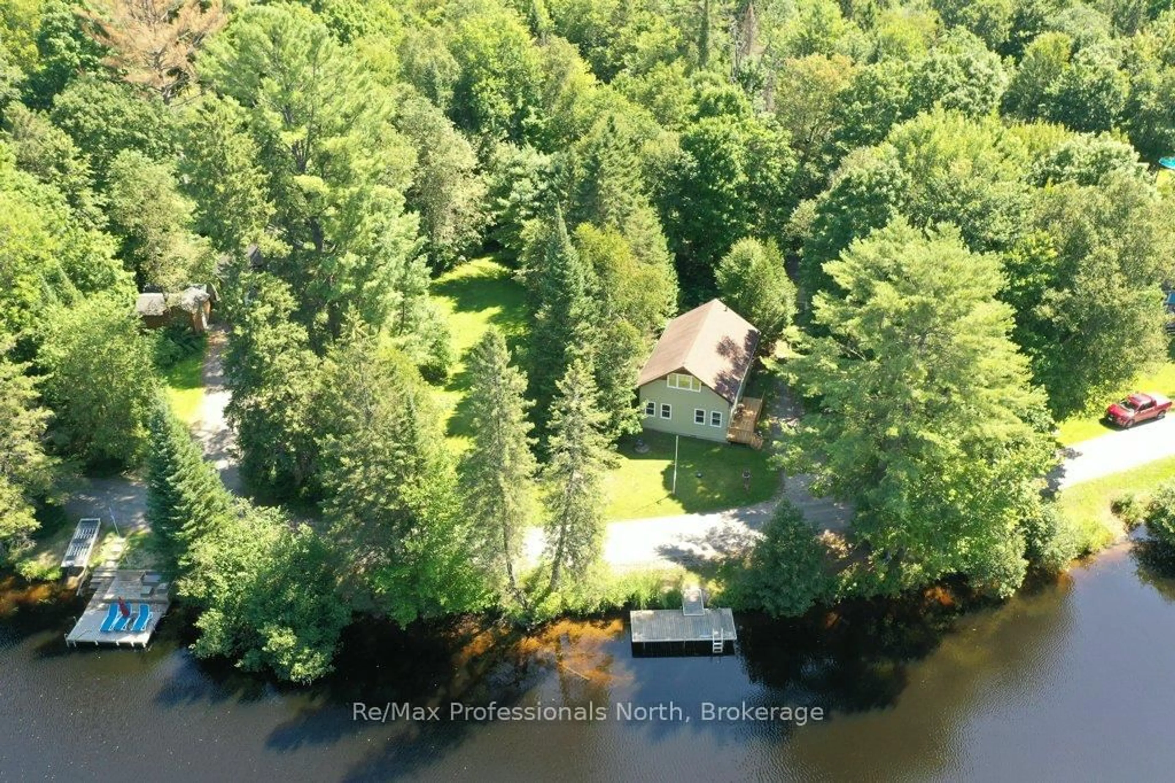 A pic from outside/outdoor area/front of a property/back of a property/a pic from drone, water/lake/river/ocean view for 1106 Springdale Shores Private, Bracebridge Ontario P1L 1W9