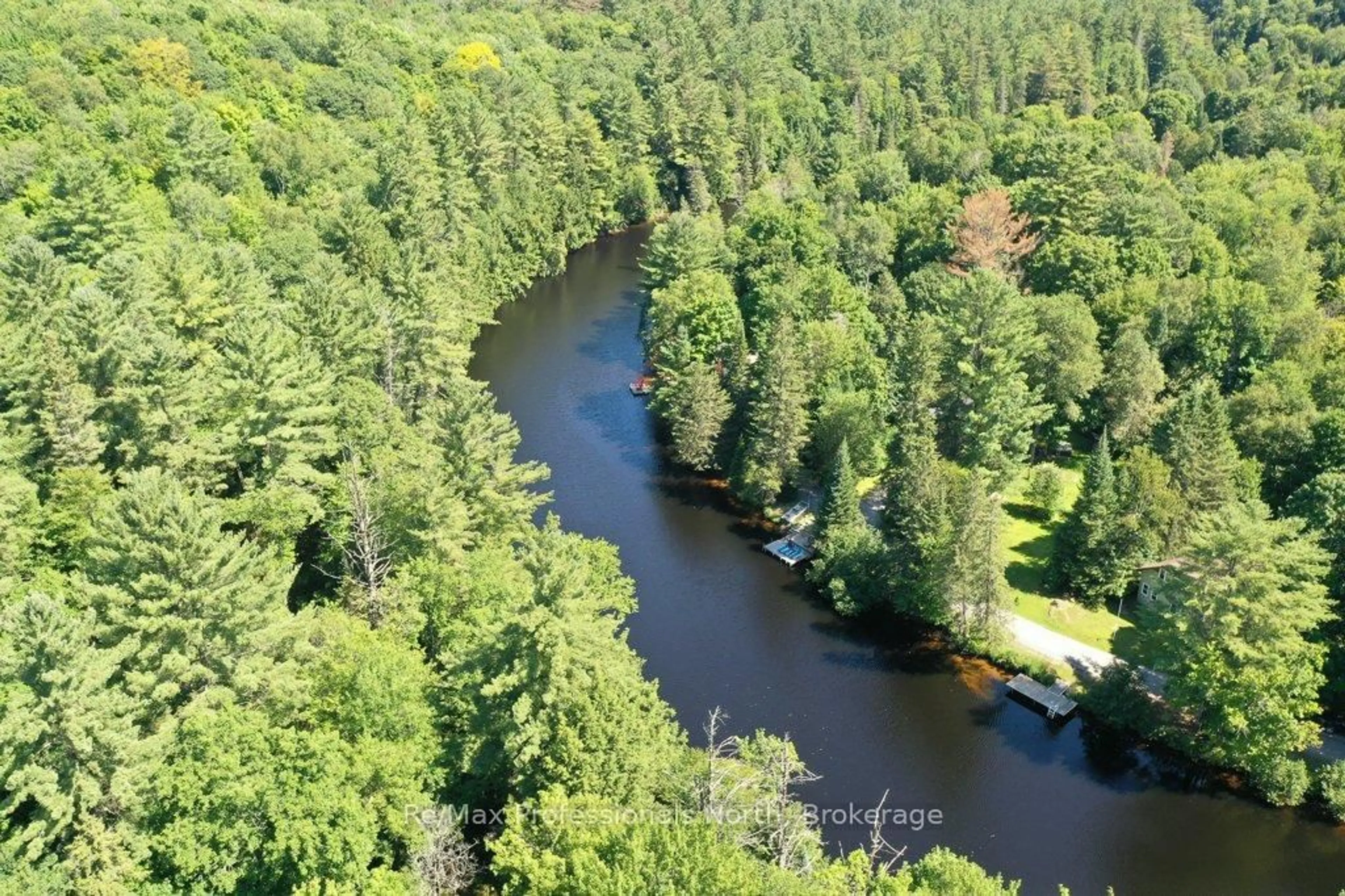 A pic from outside/outdoor area/front of a property/back of a property/a pic from drone, water/lake/river/ocean view for 1106 Springdale Shores Private, Bracebridge Ontario P1L 1W9