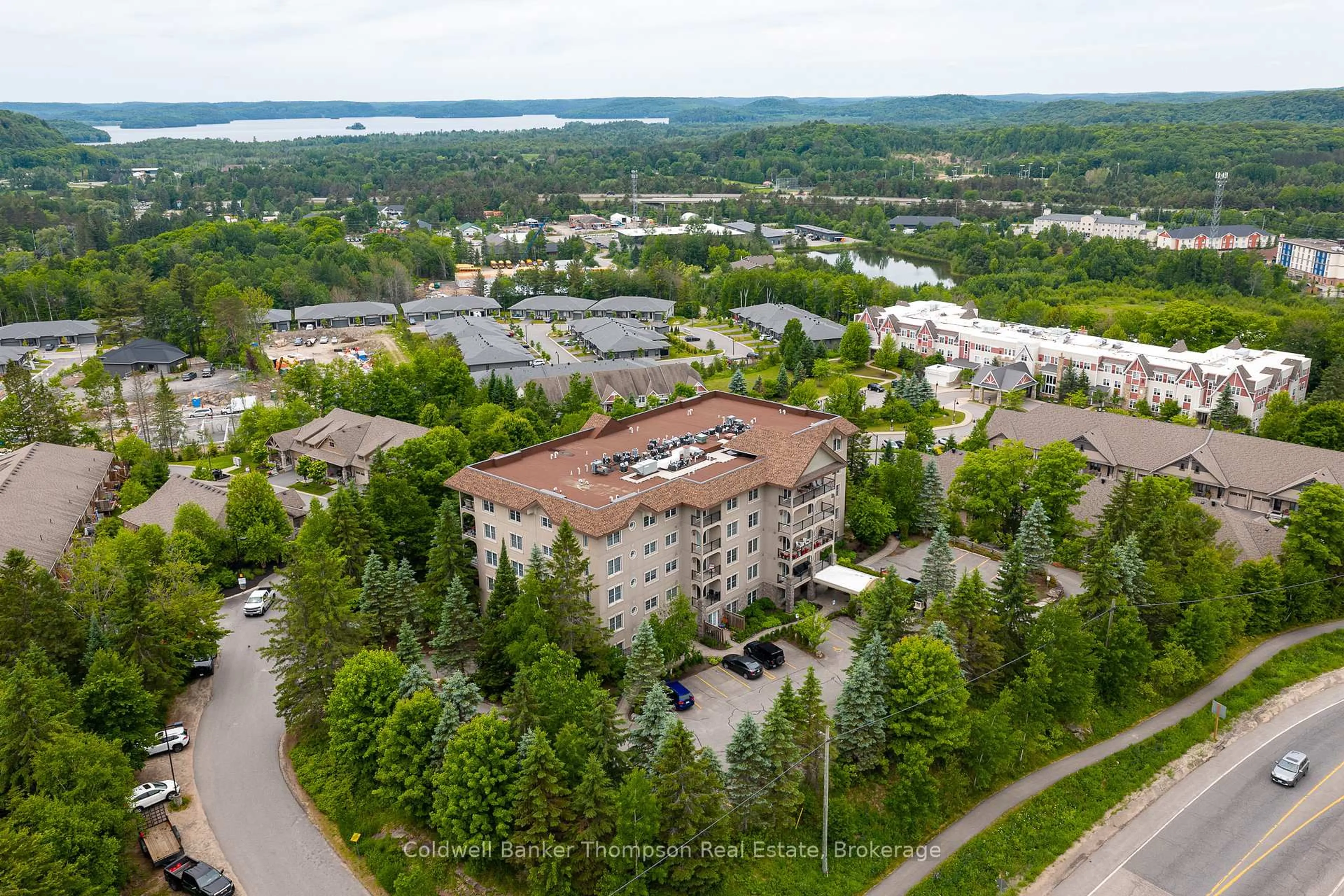 A pic from outside/outdoor area/front of a property/back of a property/a pic from drone, mountain view for 4 Legacy Lane #203, Huntsville Ontario P1H 2R2