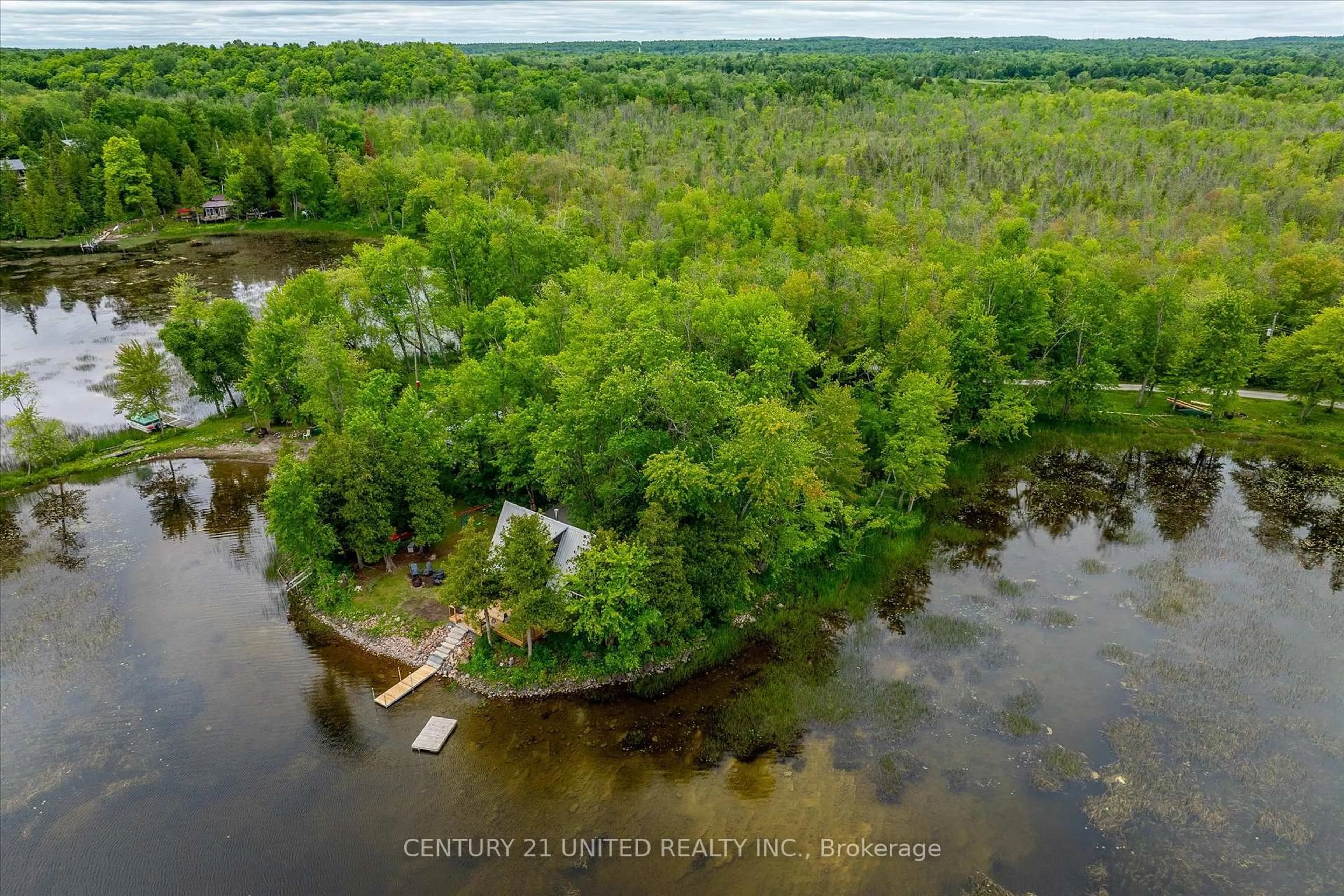 A pic from outside/outdoor area/front of a property/back of a property/a pic from drone, water/lake/river/ocean view for 168 Christie Lane, Madoc Ontario K0K 2K0