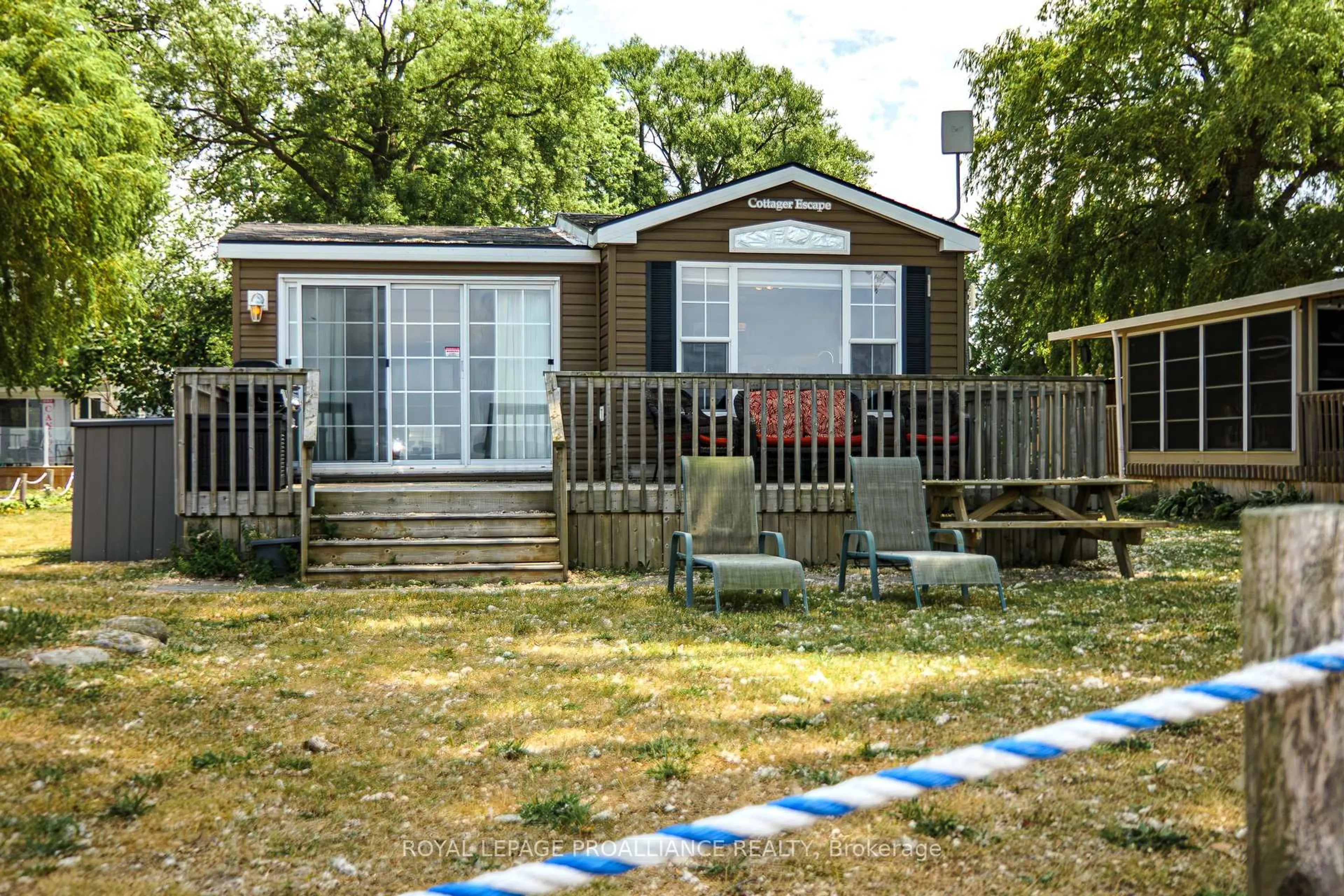 A pic from outside/outdoor area/front of a property/back of a property/a pic from drone, street for 486 County Road 18 #13 Beach view Lane, Prince Edward County Ontario K0K 1P0