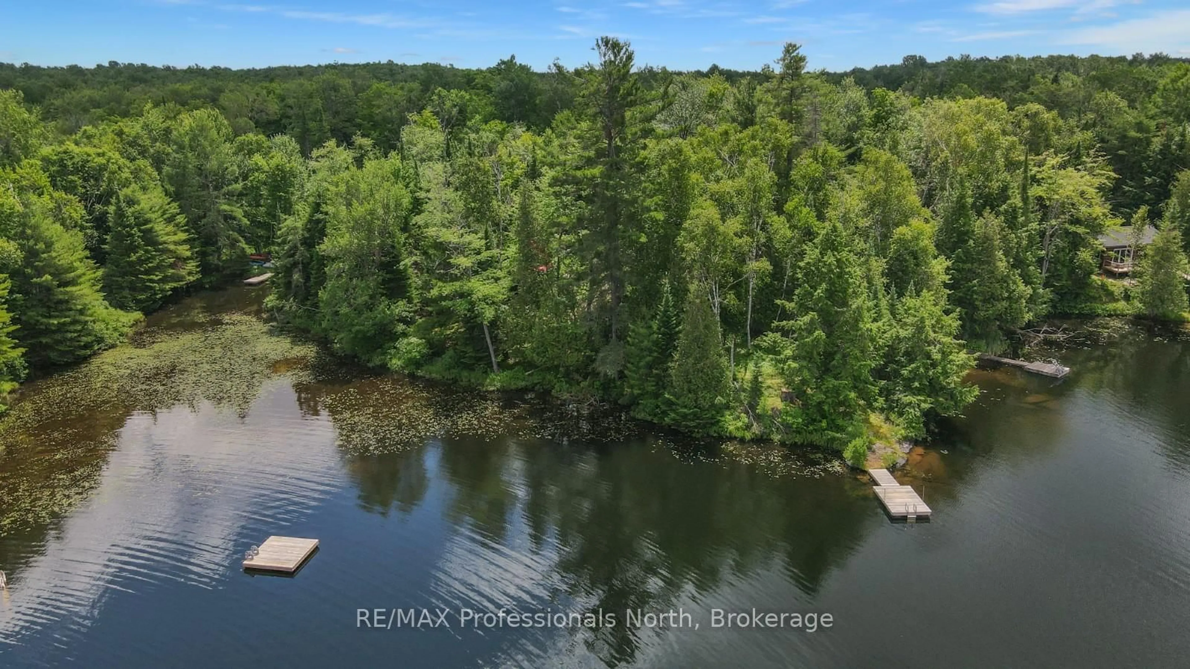 A pic from outside/outdoor area/front of a property/back of a property/a pic from drone, water/lake/river/ocean view for 1279 English Circ, Highlands East Ontario K0M 1R0