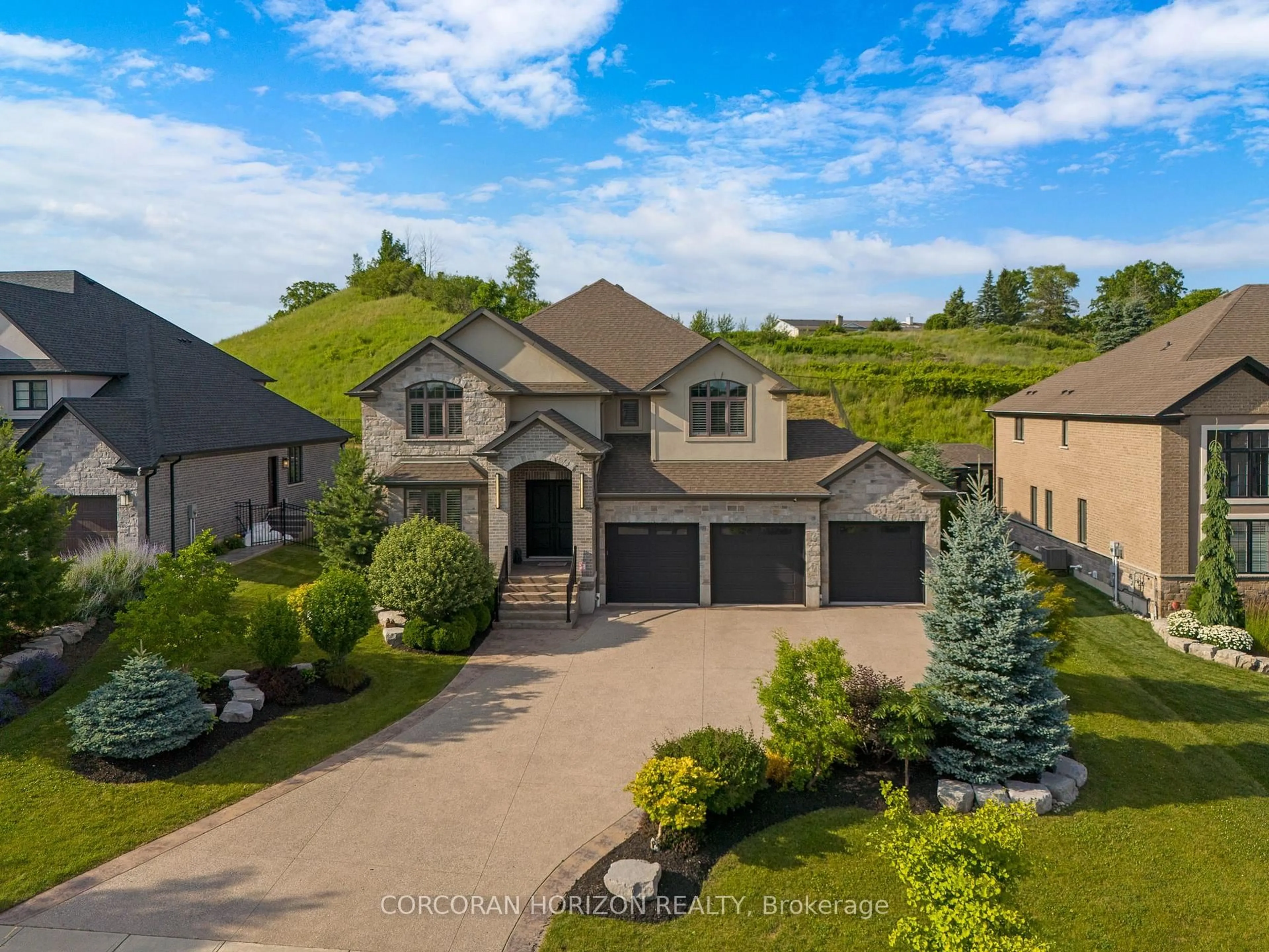 A pic from outside/outdoor area/front of a property/back of a property/a pic from drone, mountain view for 209 River Birch St, Kitchener Ontario N2C 2V3