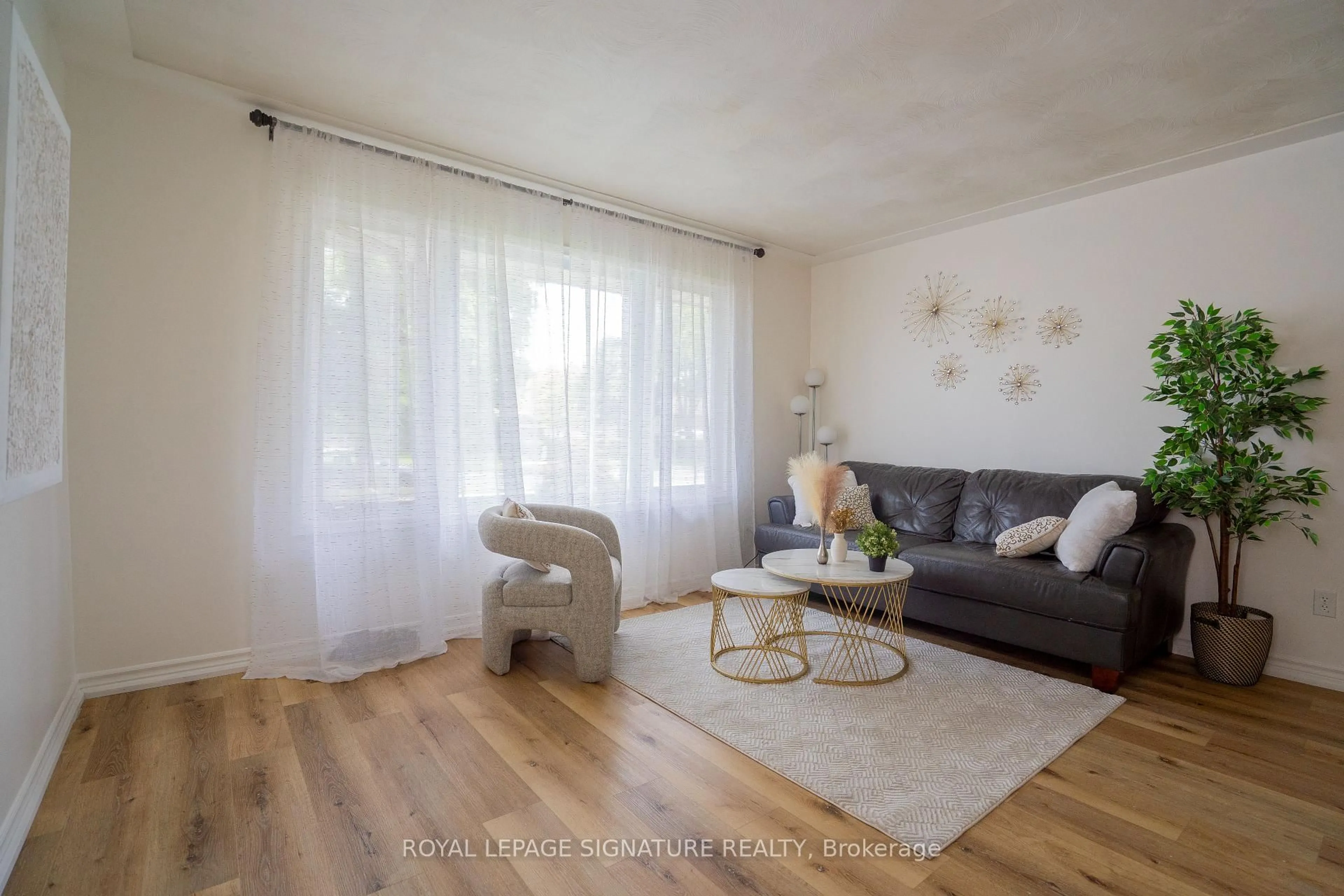 Living room with furniture, wood/laminate floor for 88 Conway Dr, Kitchener Ontario N2A 2C5