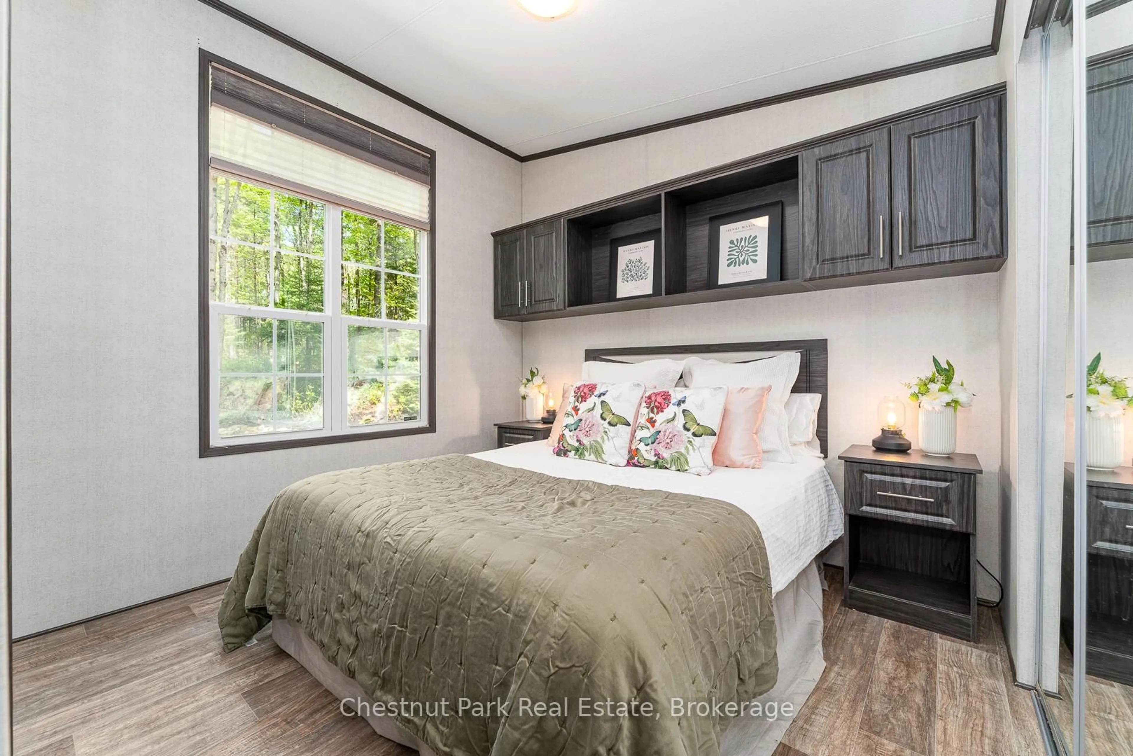 Bedroom with bed, wood/laminate floor for 1047 Bonnie Lake Camp Rd #808, Bracebridge Ontario P1L 1W9