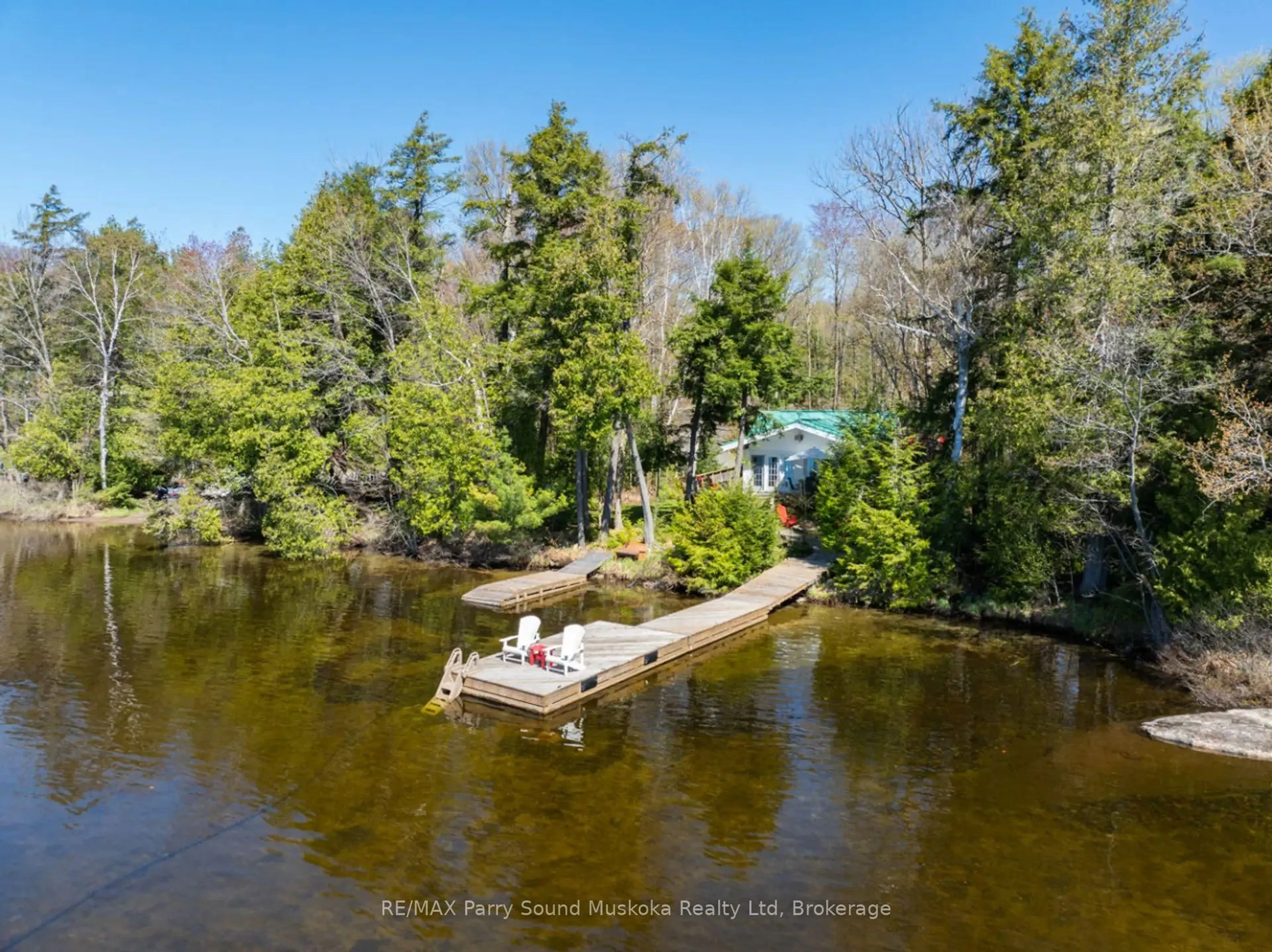 A pic from outside/outdoor area/front of a property/back of a property/a pic from drone, water/lake/river/ocean view for 99 Sugar Lake Rd, Seguin Ontario P2A 0B6