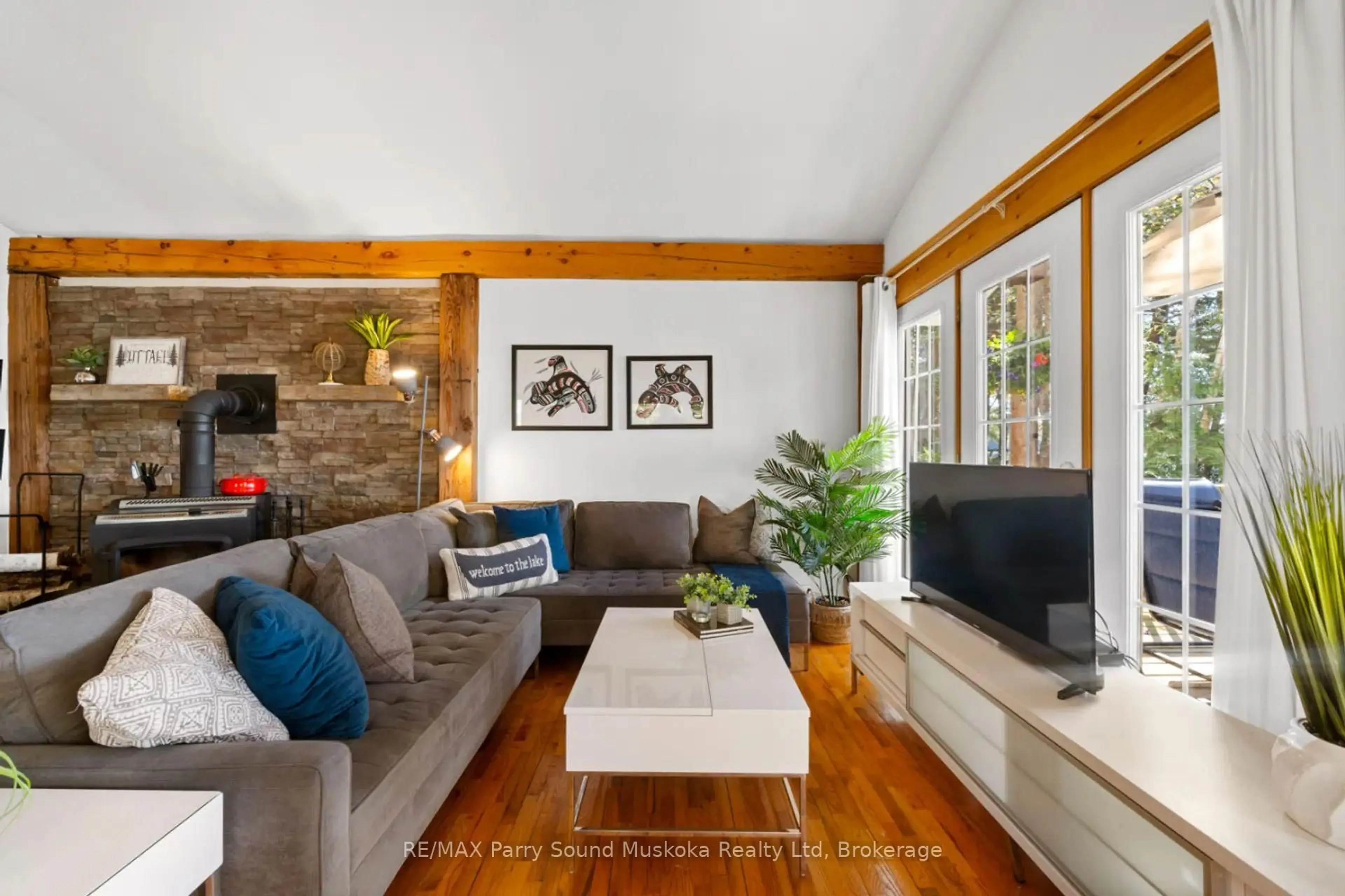 Living room with furniture, wood/laminate floor for 99 Sugar Lake Rd, Seguin Ontario P2A 0B6