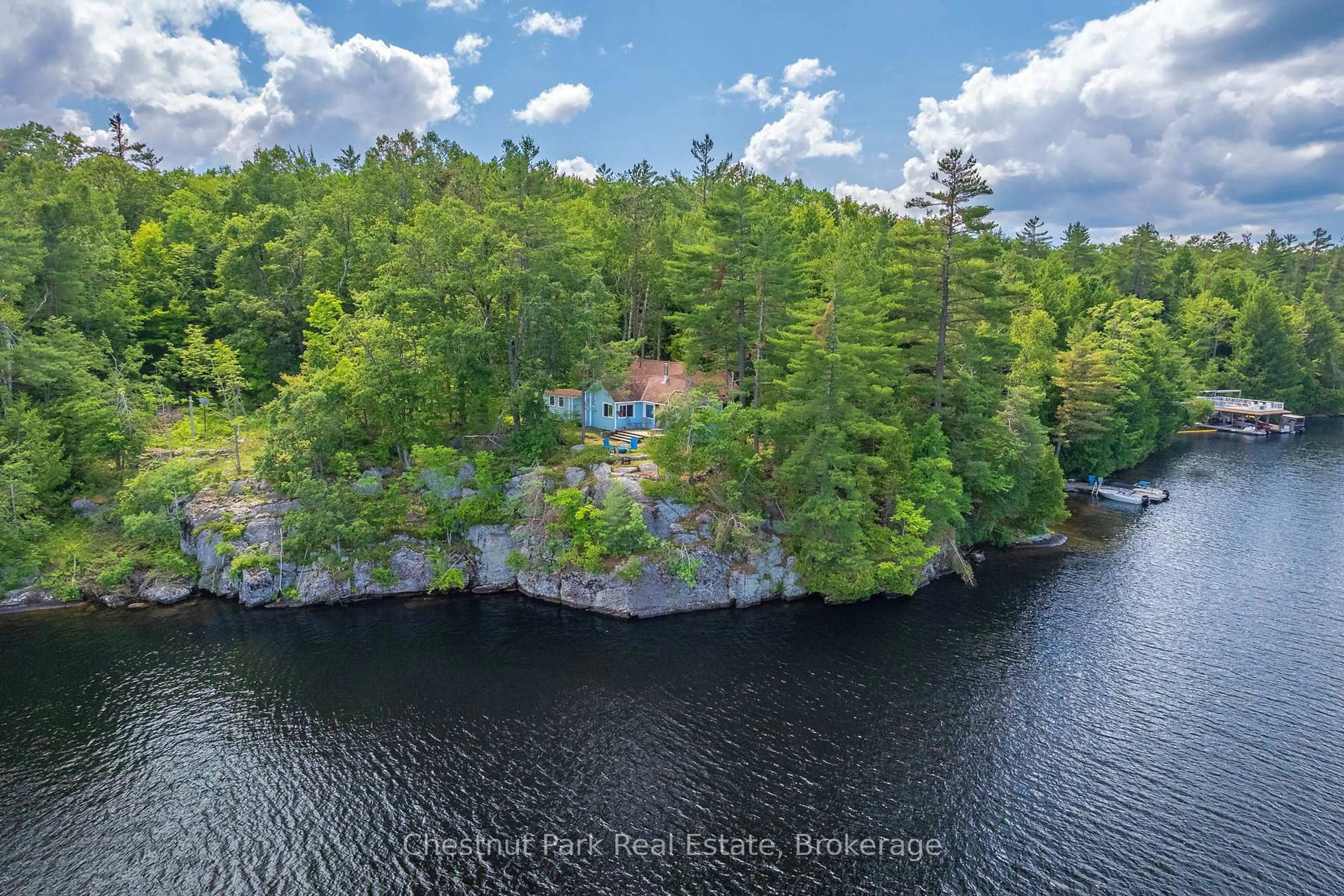 A pic from outside/outdoor area/front of a property/back of a property/a pic from drone, water/lake/river/ocean view for 26 Taylor Island 26LM, Gravenhurst Ontario P1P 1R2