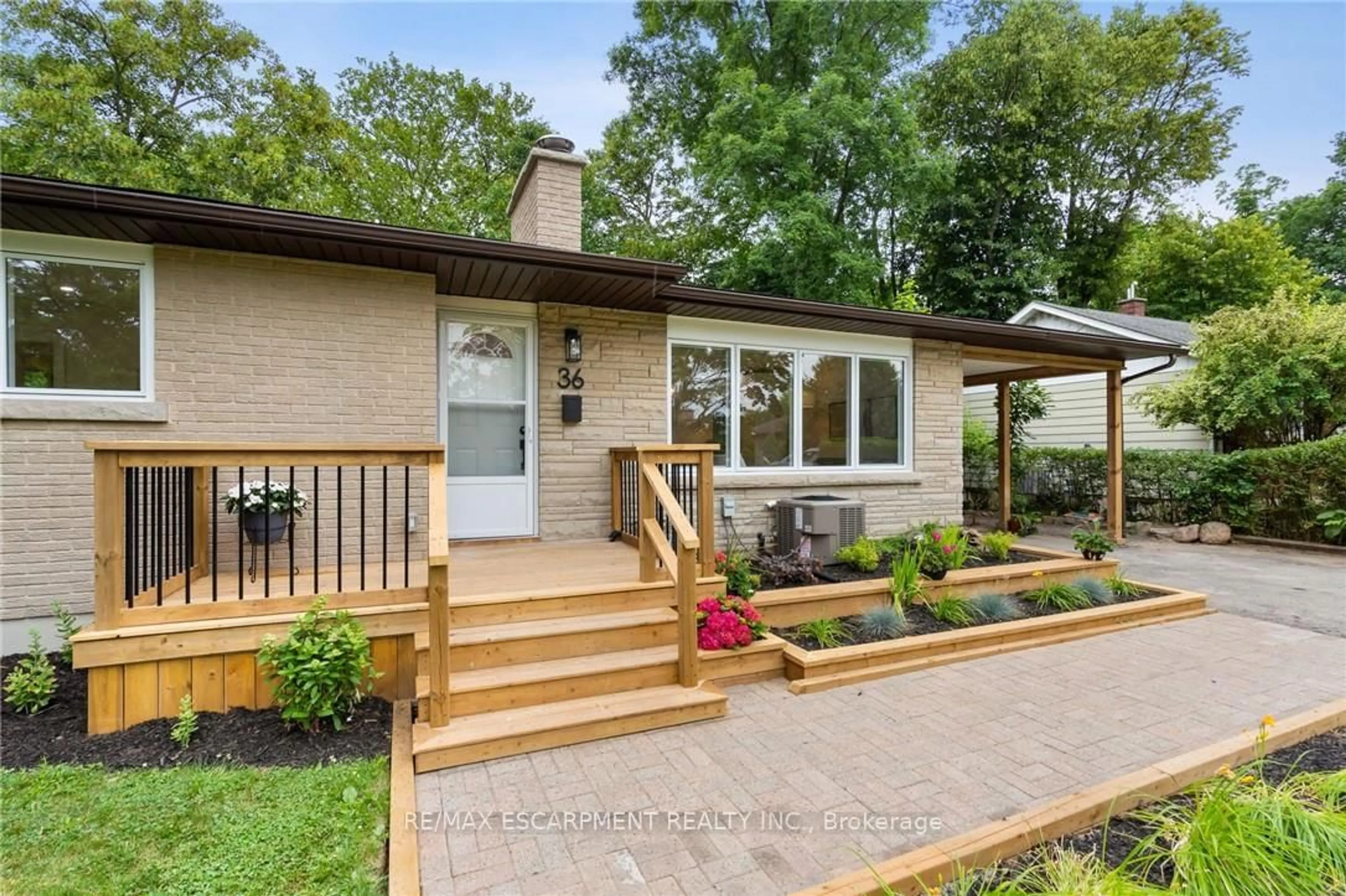 Home with brick exterior material, street for 36 Spring Garden Blvd, St. Catharines Ontario L2N 3P6