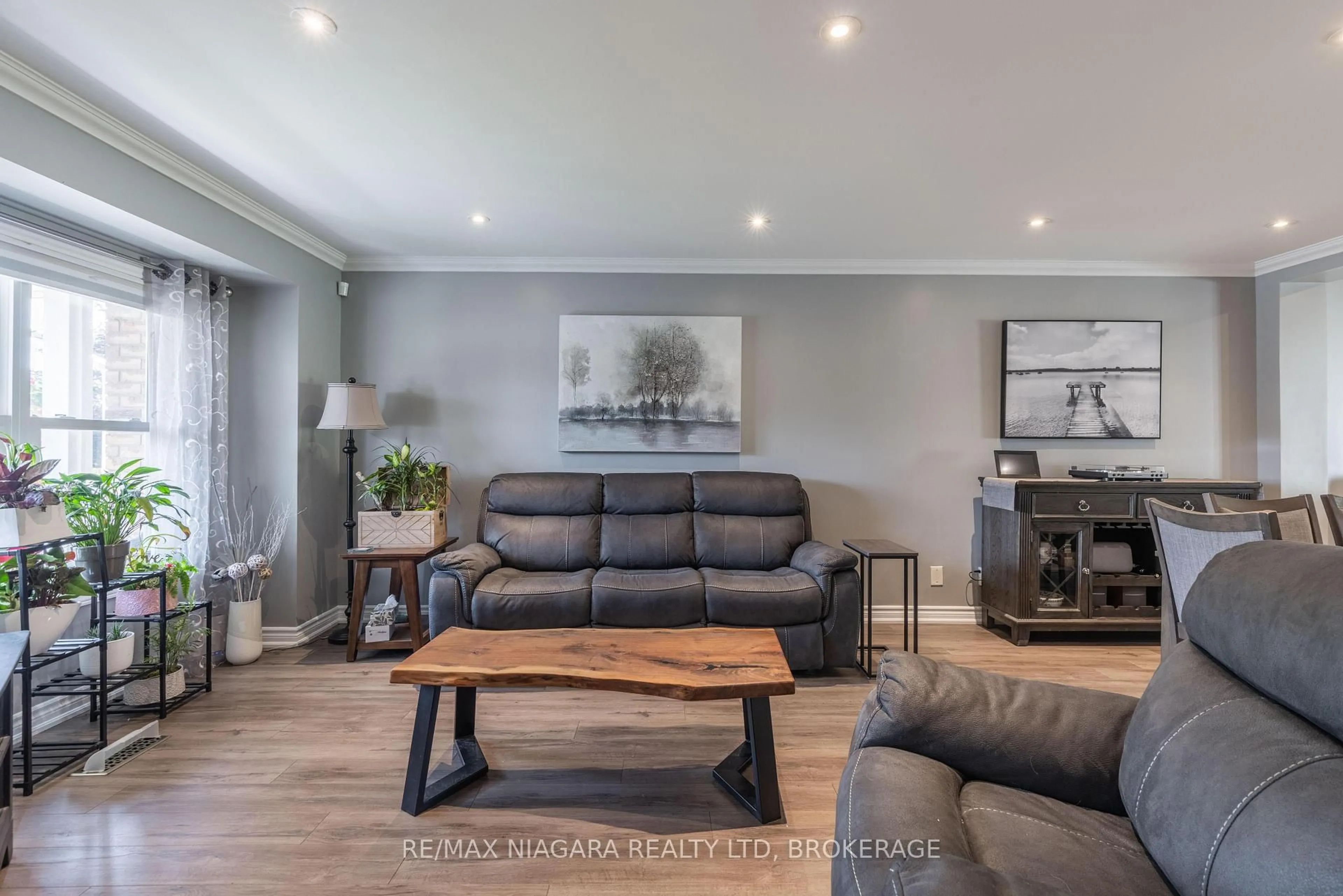 Living room with furniture, wood/laminate floor for 8 Apollo Dr, Port Colborne Ontario L3K 6B3