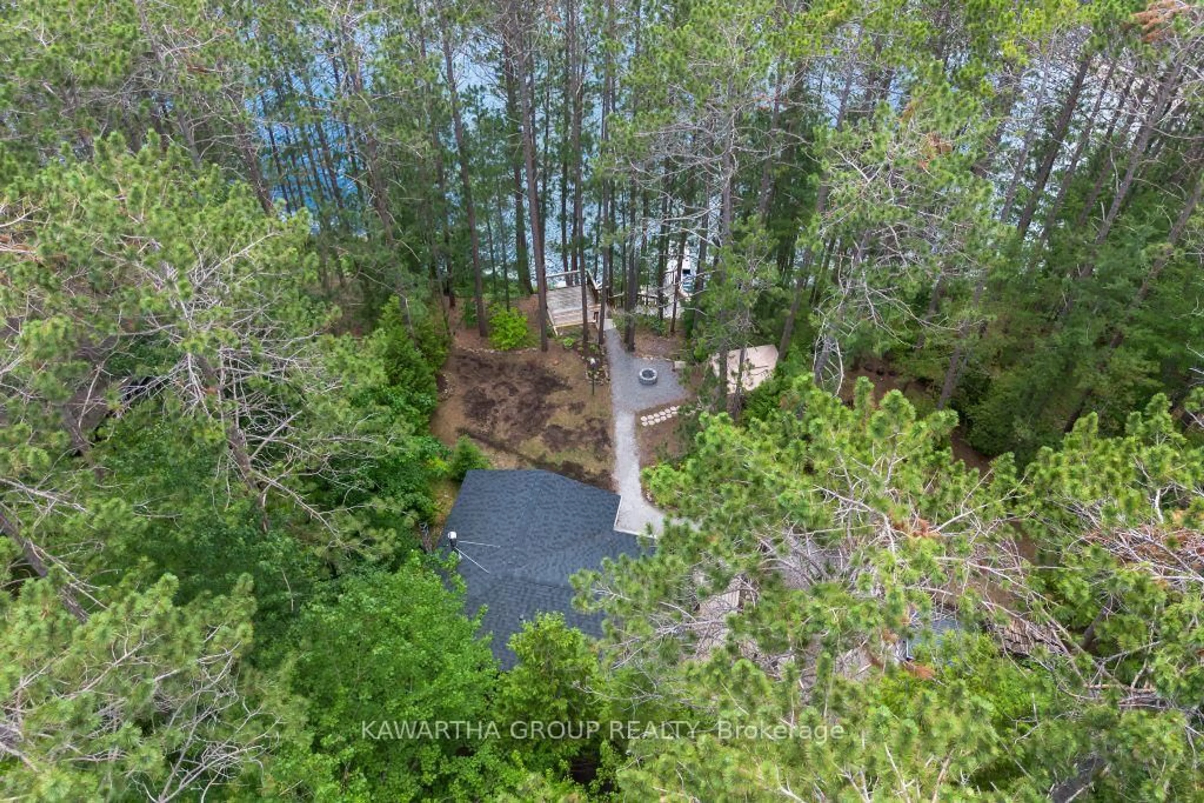 A pic from outside/outdoor area/front of a property/back of a property/a pic from drone, forest/trees view for 1339 Spar Lake Rd, Minden Hills Ontario K0M 2L1
