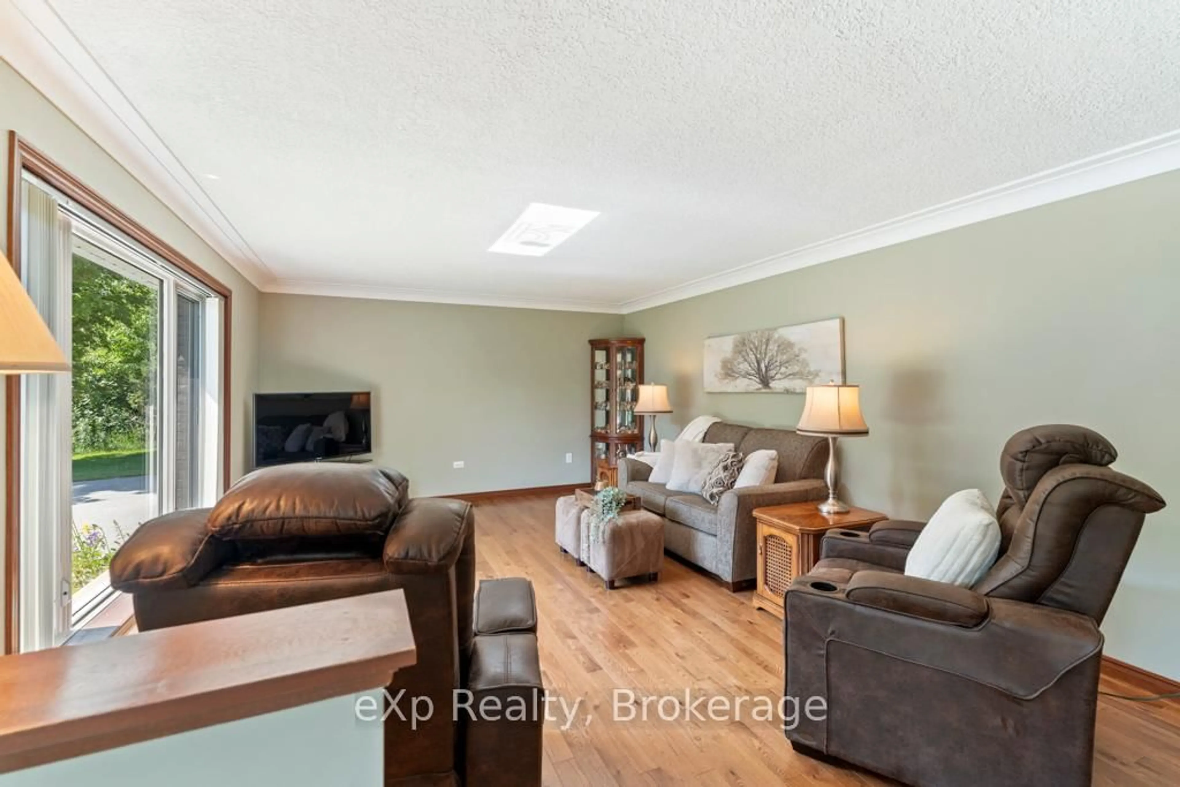 Living room with furniture, wood/laminate floor for 29 Everett Rd, South Bruce Peninsula Ontario N0H 2T0