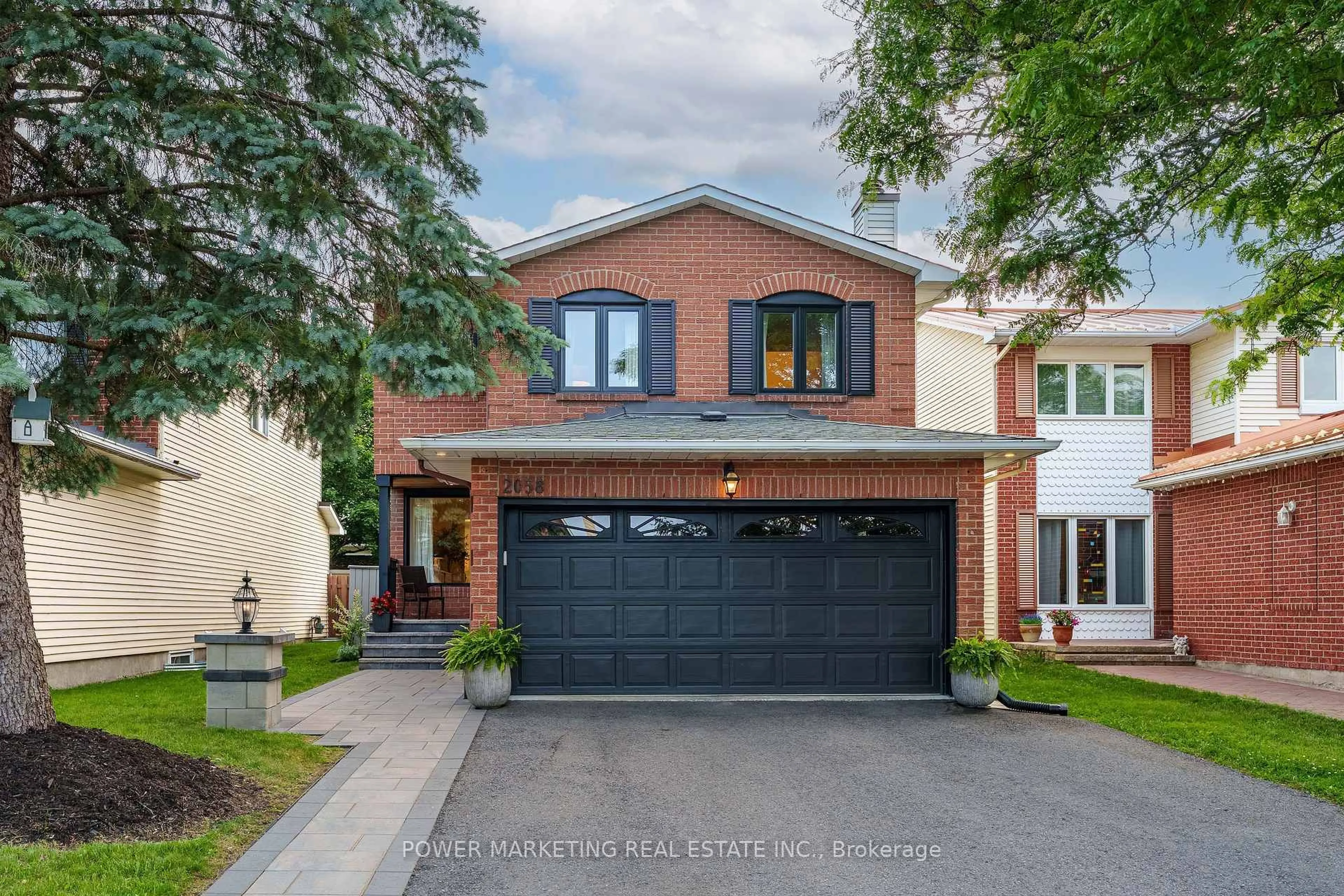 Home with brick exterior material, street for 2058 Wildflower Dr, Orleans Ontario K1E 3R3