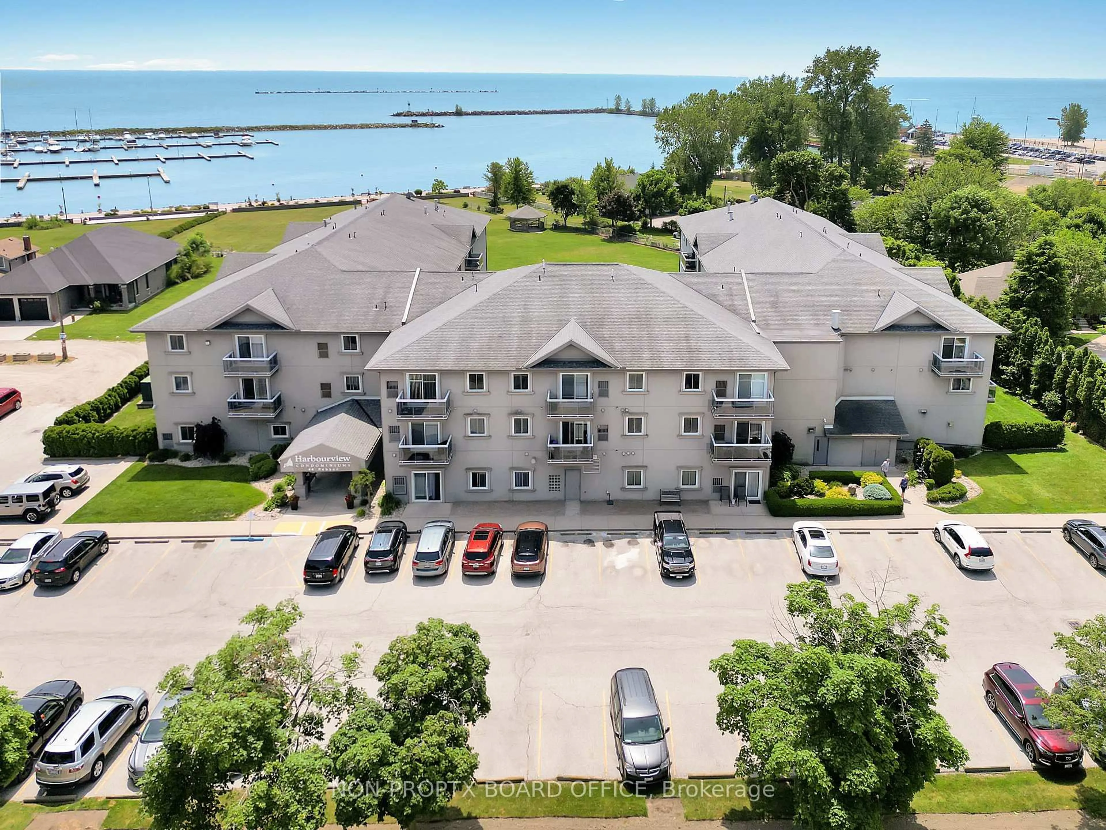 A pic from outside/outdoor area/front of a property/back of a property/a pic from drone, water/lake/river/ocean view for 44 Robson Rd #216, Leamington Ontario N8H 5E4