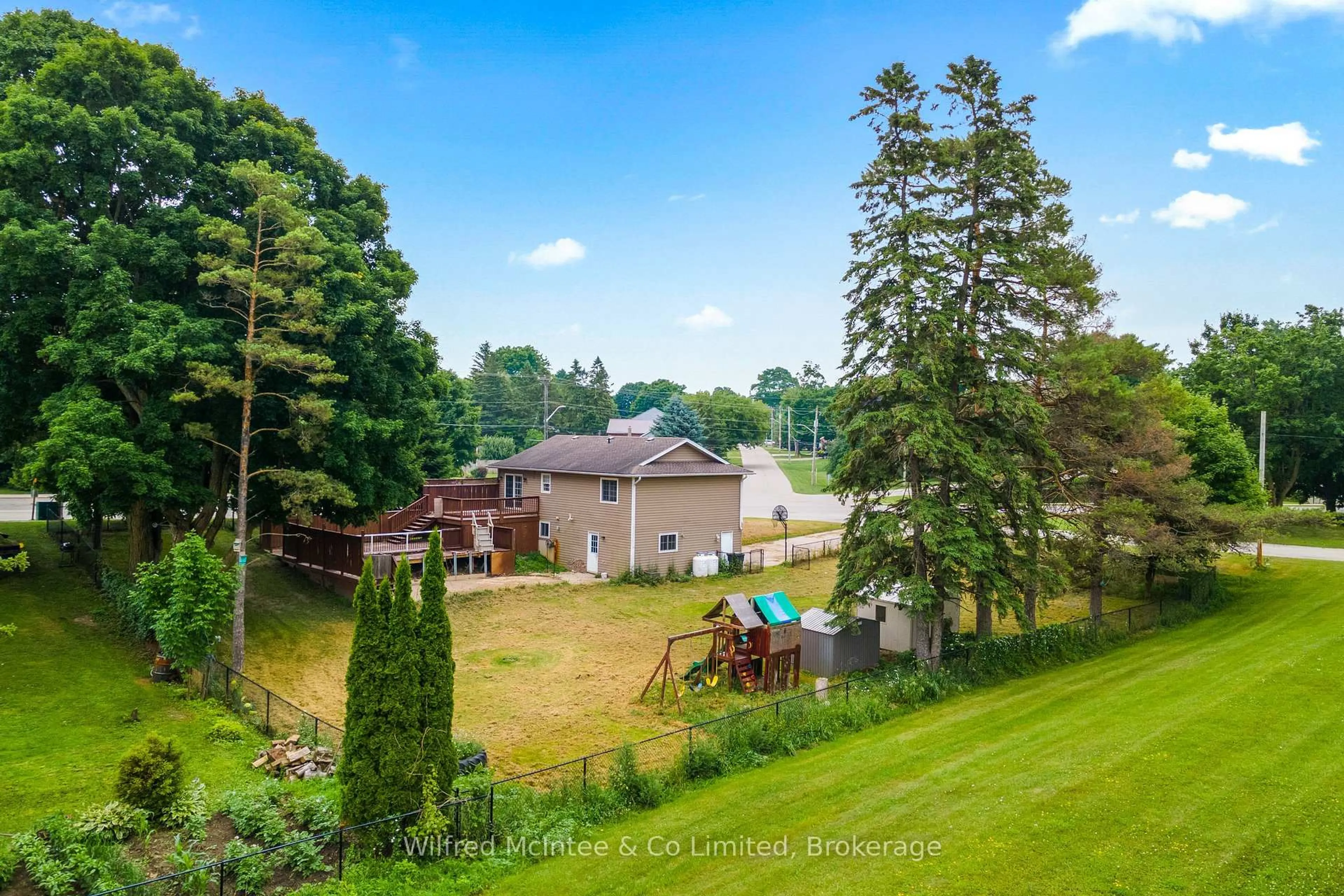 A pic from outside/outdoor area/front of a property/back of a property/a pic from drone, forest/trees view for 1057 Ann St, Howick Ontario N0G 2X0