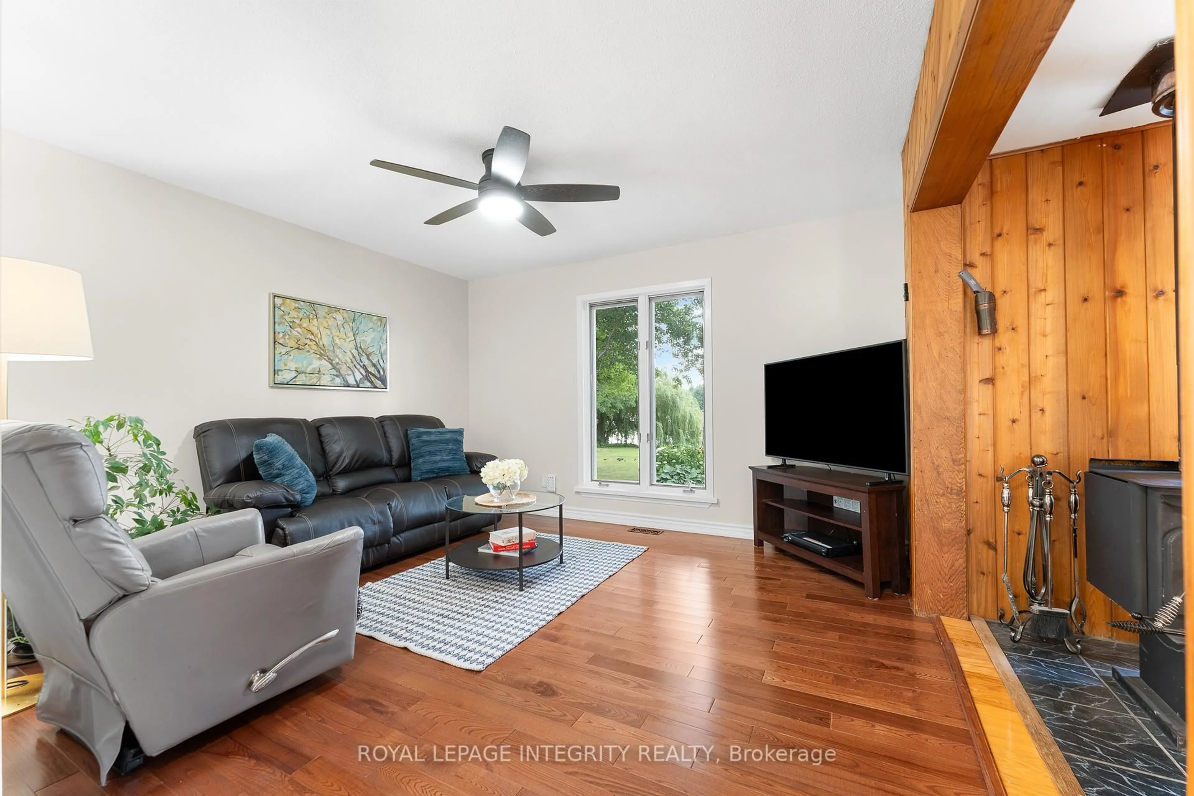 Living room with furniture, wood/laminate floor for 7403 Rideau Valley Dr, Kars Ontario K0A 2E0