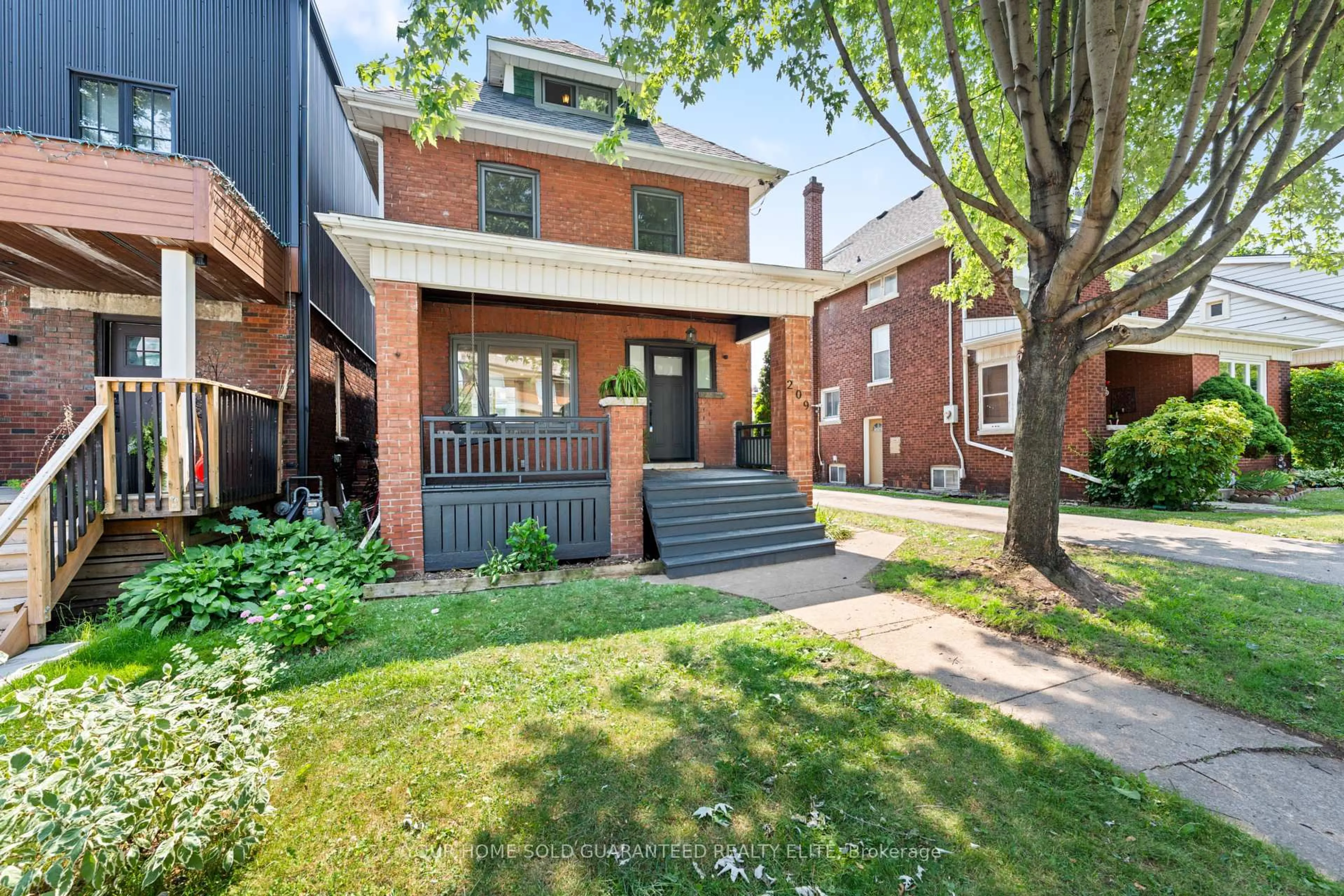 Home with brick exterior material, street for 209 Rothsay Ave, Hamilton Ontario L8M 3G6