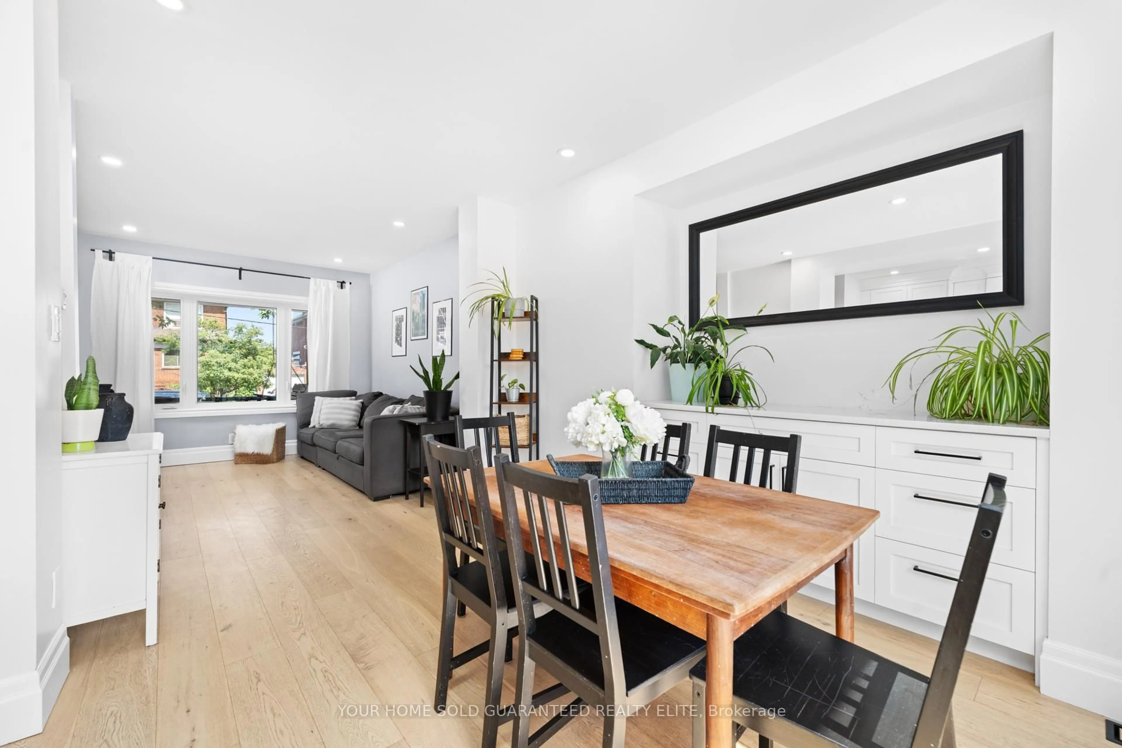 Dining room, wood/laminate floor for 209 Rothsay Ave, Hamilton Ontario L8M 3G6