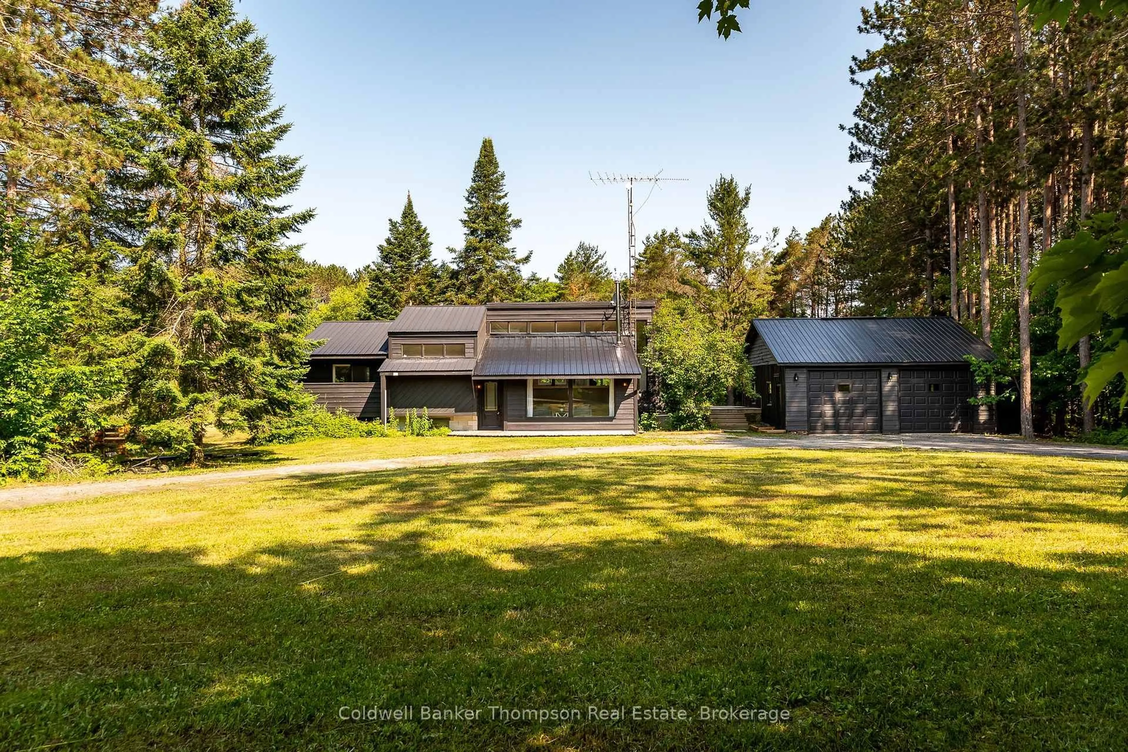 A pic from outside/outdoor area/front of a property/back of a property/a pic from drone, unknown for 1049 Lawrence Pit Rd, Muskoka Lakes Ontario P0B 1M0