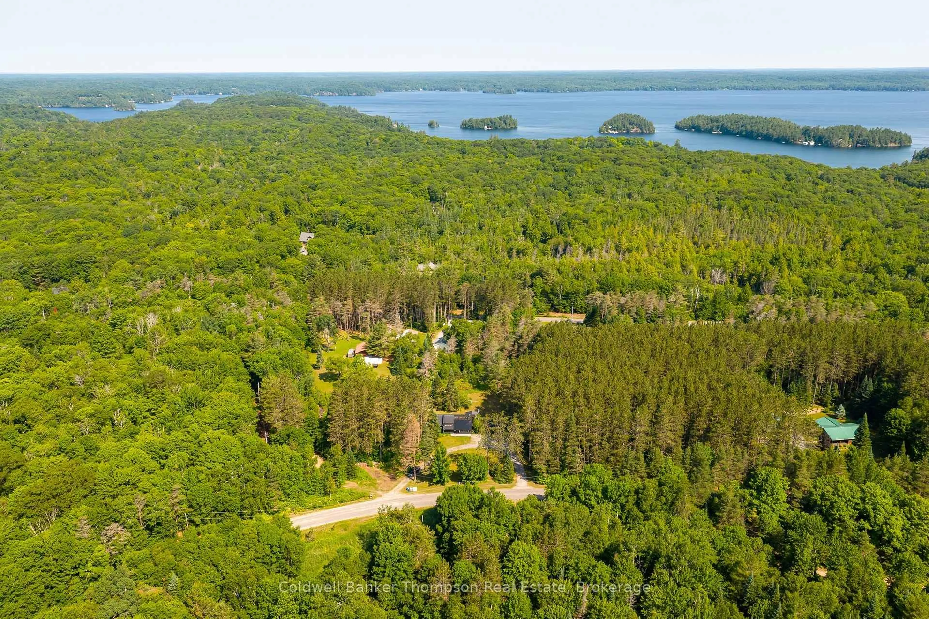 A pic from outside/outdoor area/front of a property/back of a property/a pic from drone, water/lake/river/ocean view for 1049 Lawrence Pit Rd, Muskoka Lakes Ontario P0B 1M0